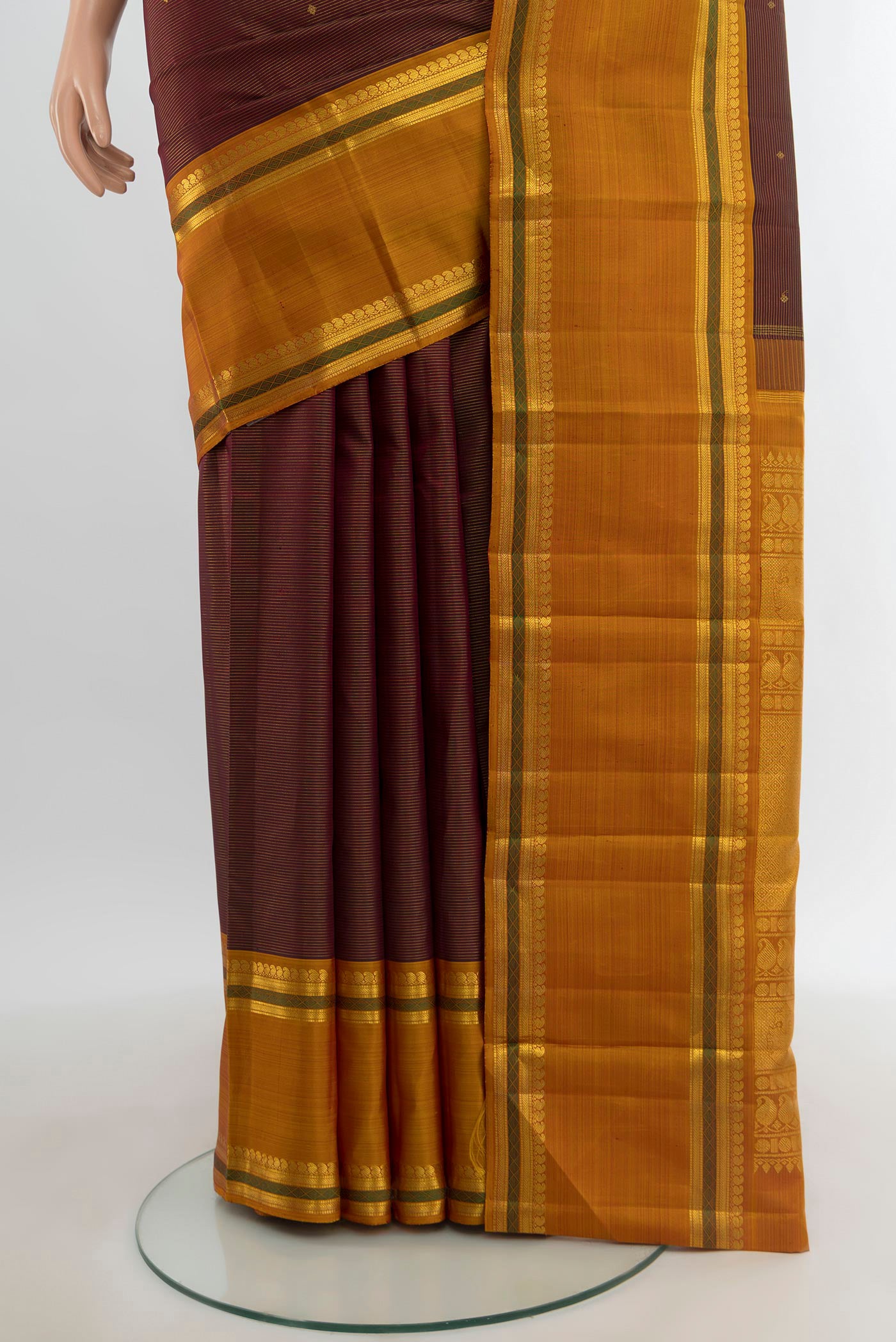 Pleats and pallu of Pure Silk Pure Zari Maroon Kanchipuram Saree with Zari Brocade on the body and Zari Border. 