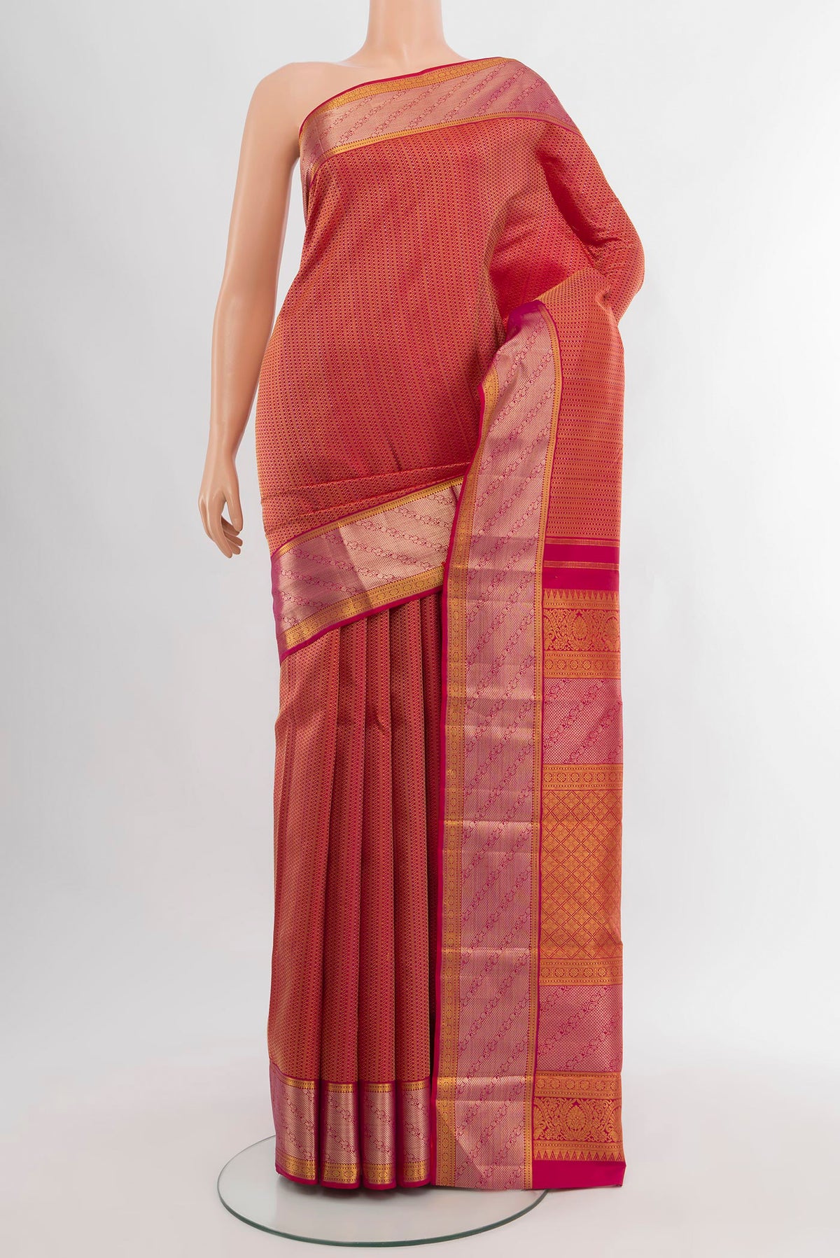 Dark Pink Kanchipuram Silk Saree with Zari Brocade on the body and Zari Border.  displayed on a mannequin