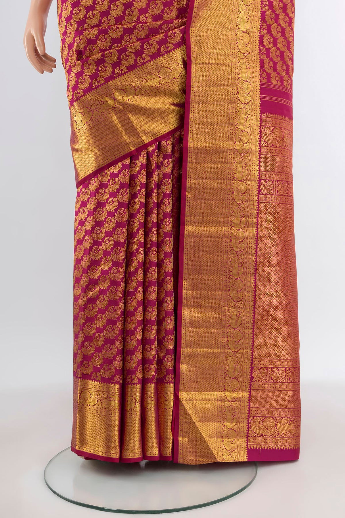 Pleats and pallu of Magenta Kanchipuram Silk Saree with Zari Brocade on the body and Zari Border. 