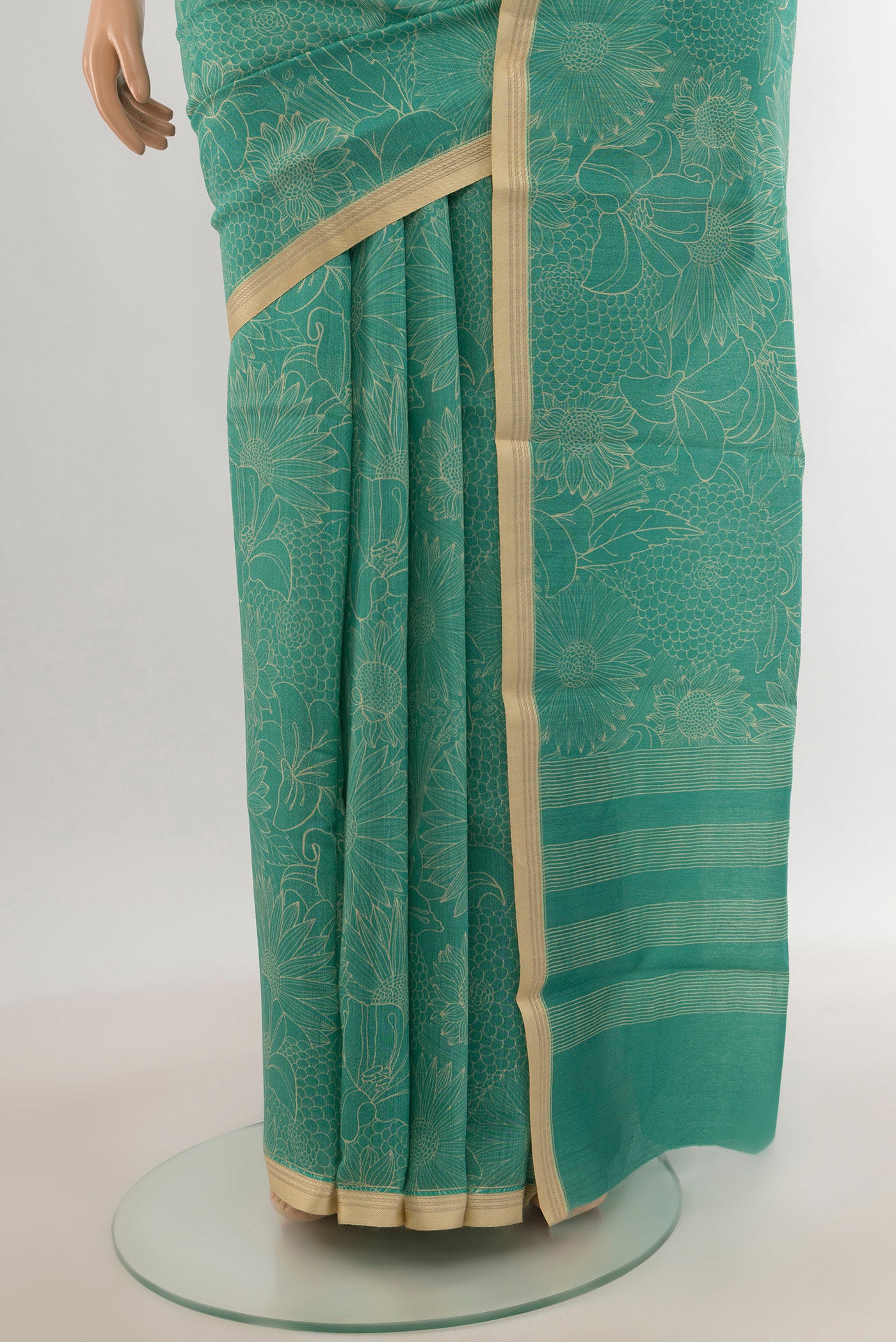 Pleats and pallu of Sky Blue Tussar Silk Saree with Floral Print on the body and Zari Border. 