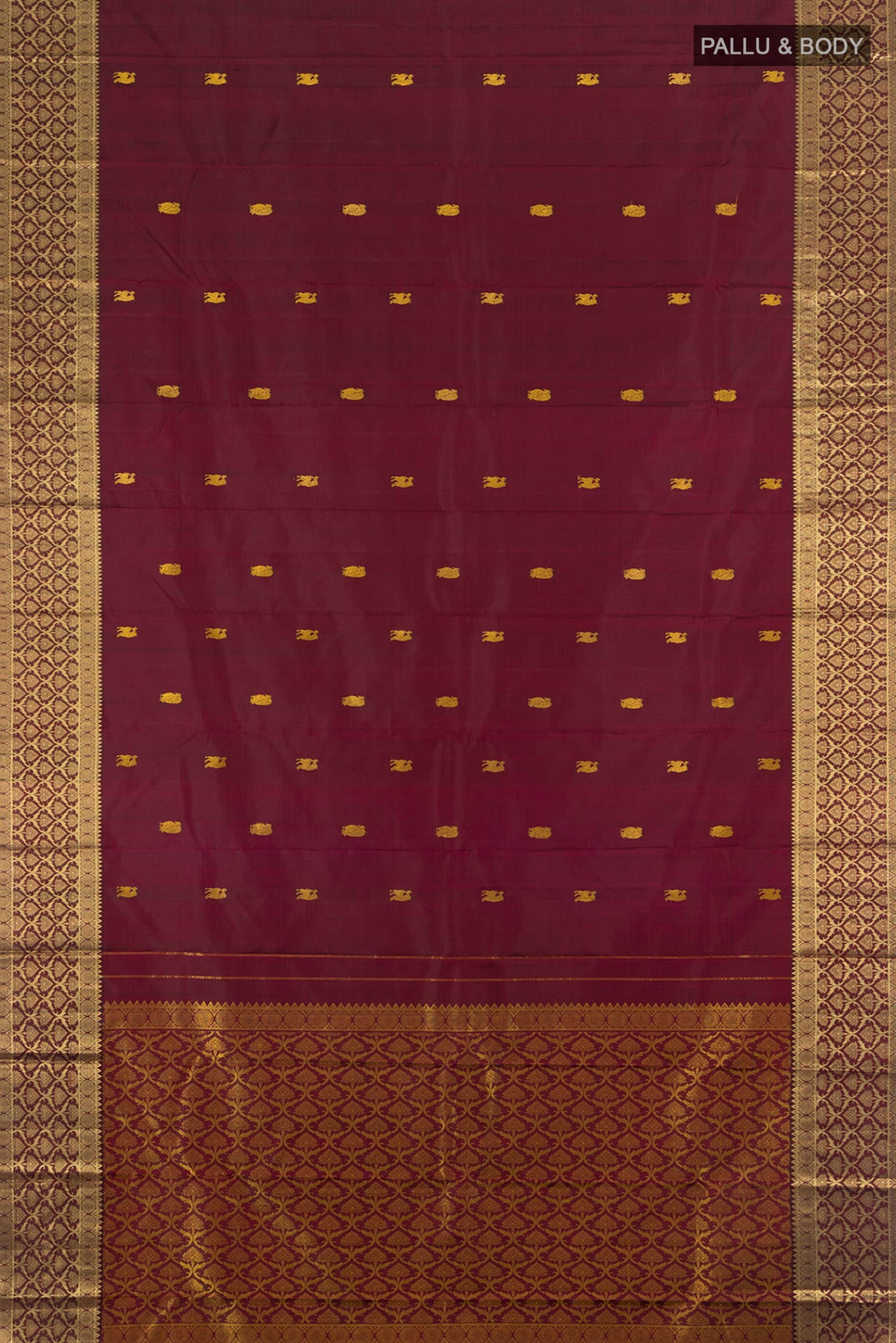 Flat view of Maroon Kanjivaram Silk Saree with Thread Butta on the body and Zari Border. 
