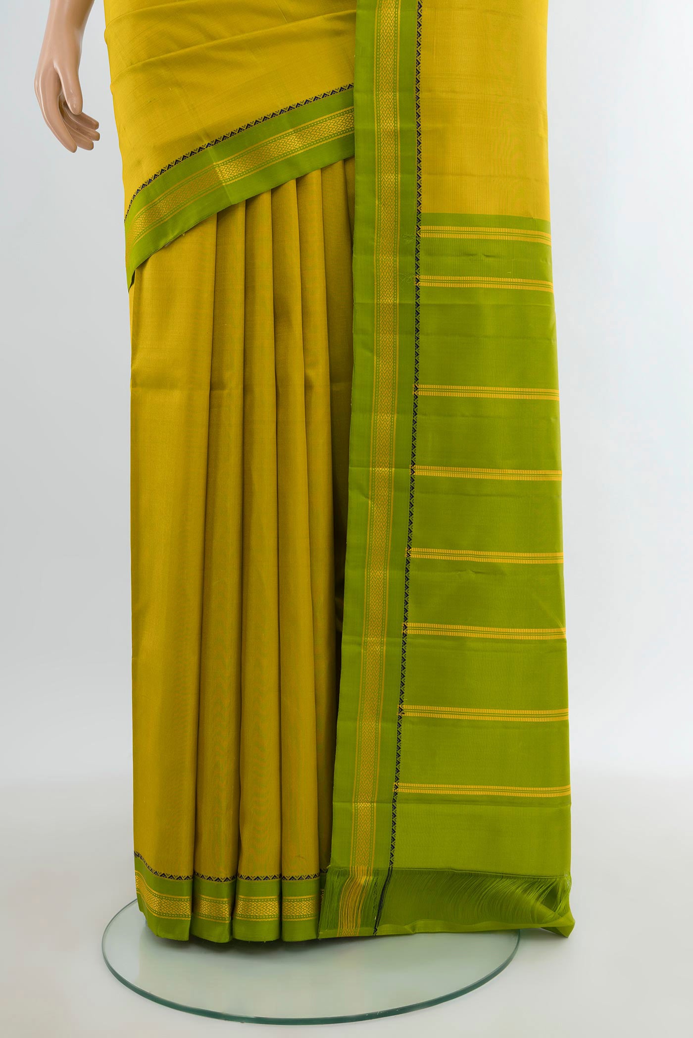 Pleats and pallu of Light Green Kanjivaram Silk Saree with Plain Body and Zari Border. 
