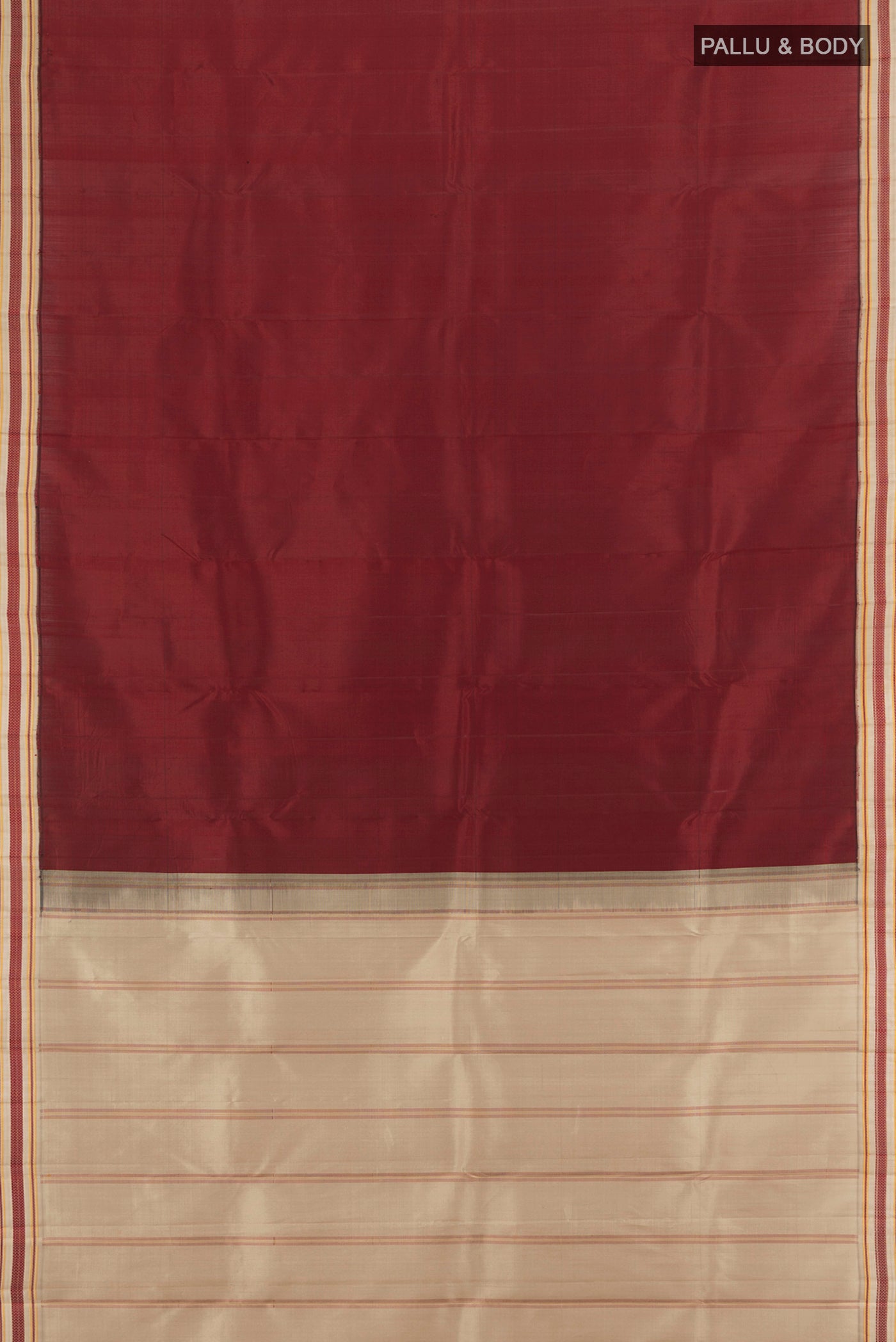 Flat view of Maroon Kanjivaram Silk Saree with Plain Body and Thread Border. 