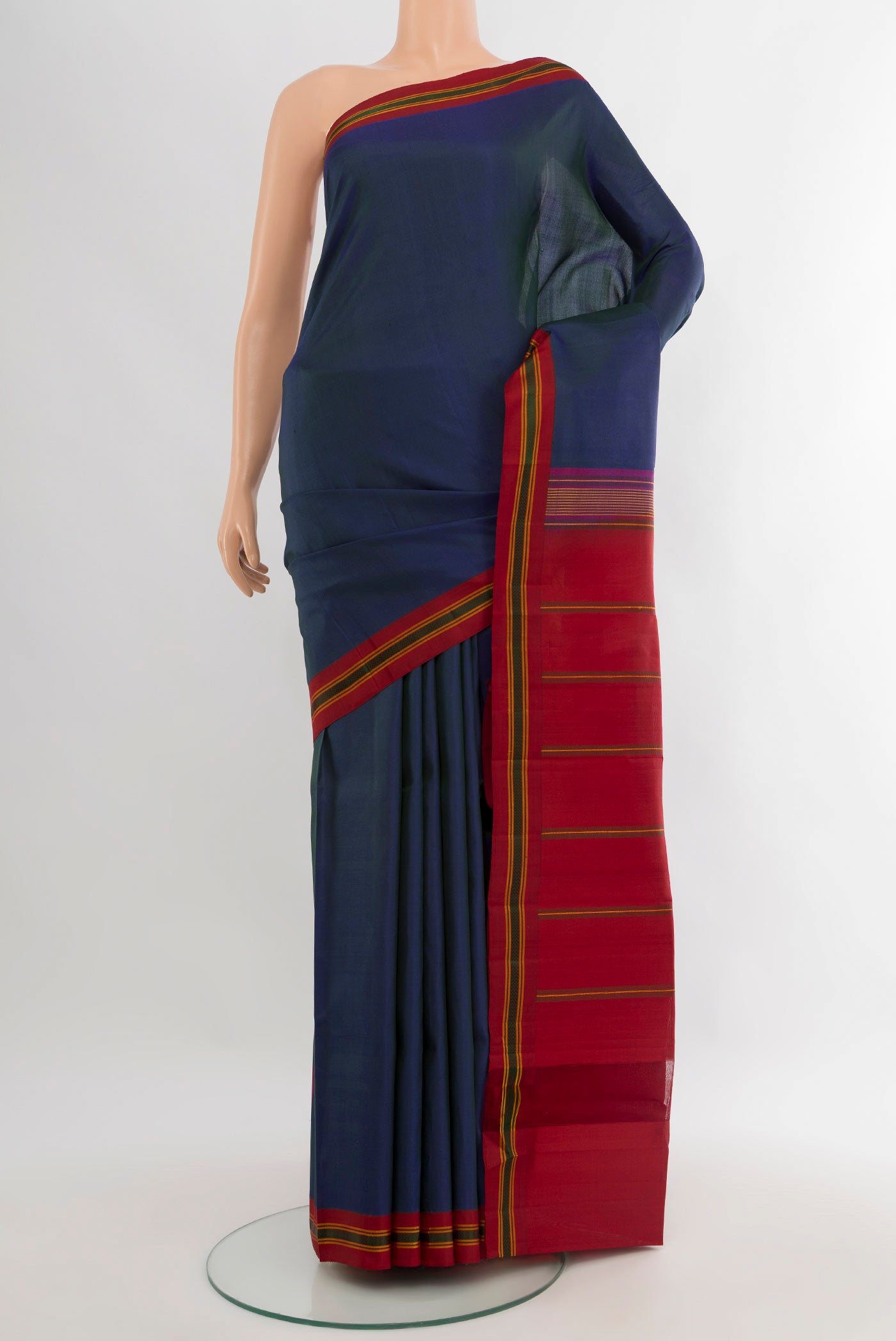 Peacock Blue Kanjivaram Silk Saree with Plain Body and Thread Border.  displayed on a mannequin