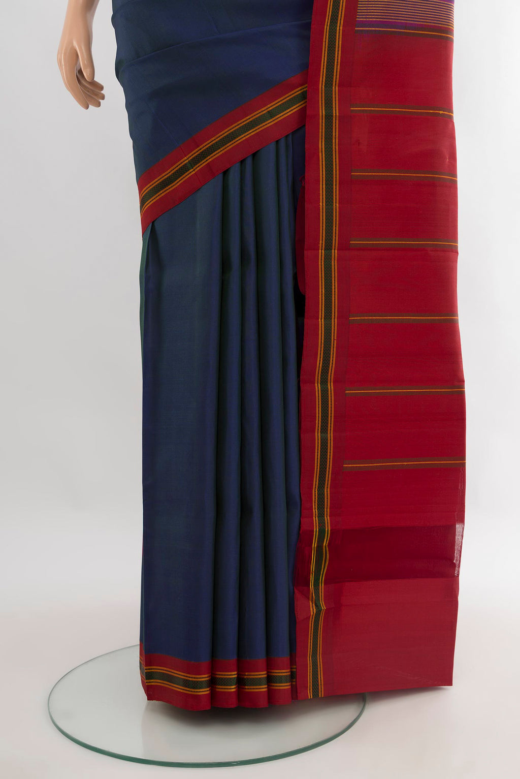 Pleats and pallu of Peacock Blue Kanjivaram Silk Saree with Plain Body and Thread Border. 