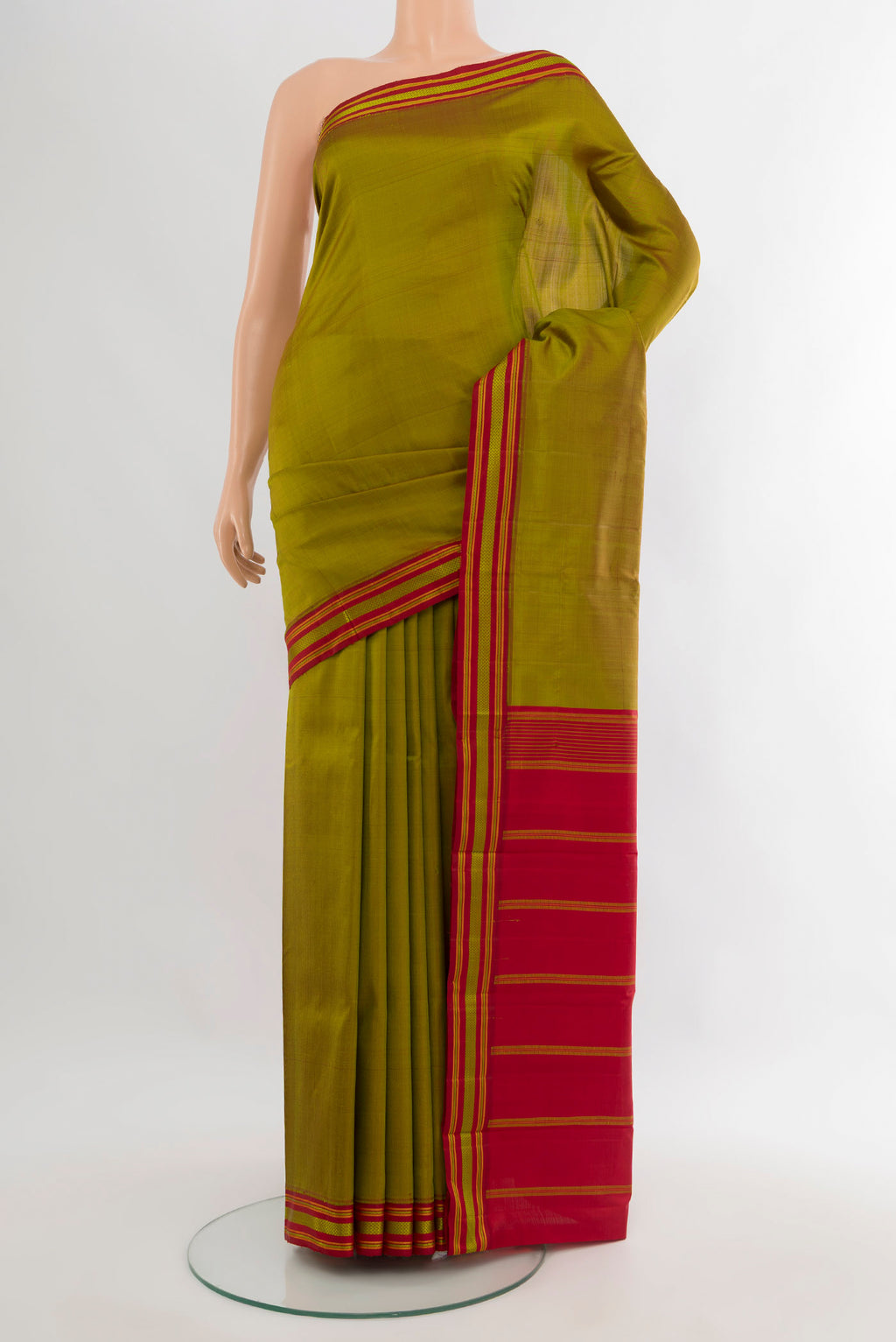 Mehandi Green Kanjivaram Silk Saree with Plain Body and Thread Border.  displayed on a mannequin