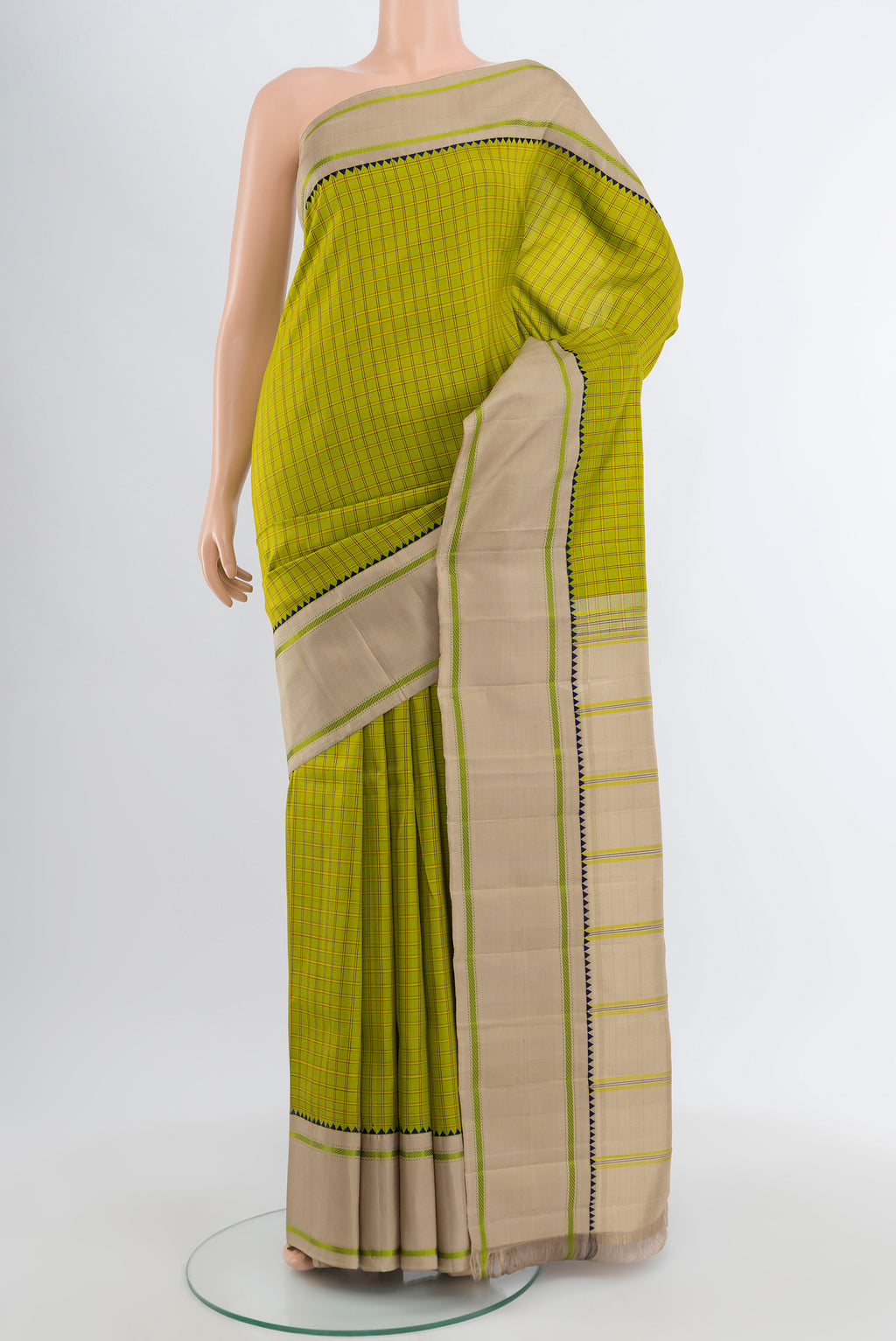 Light Green Kanjivaram Silk Saree with Checked design on the body and Plain Border.  displayed on a mannequin