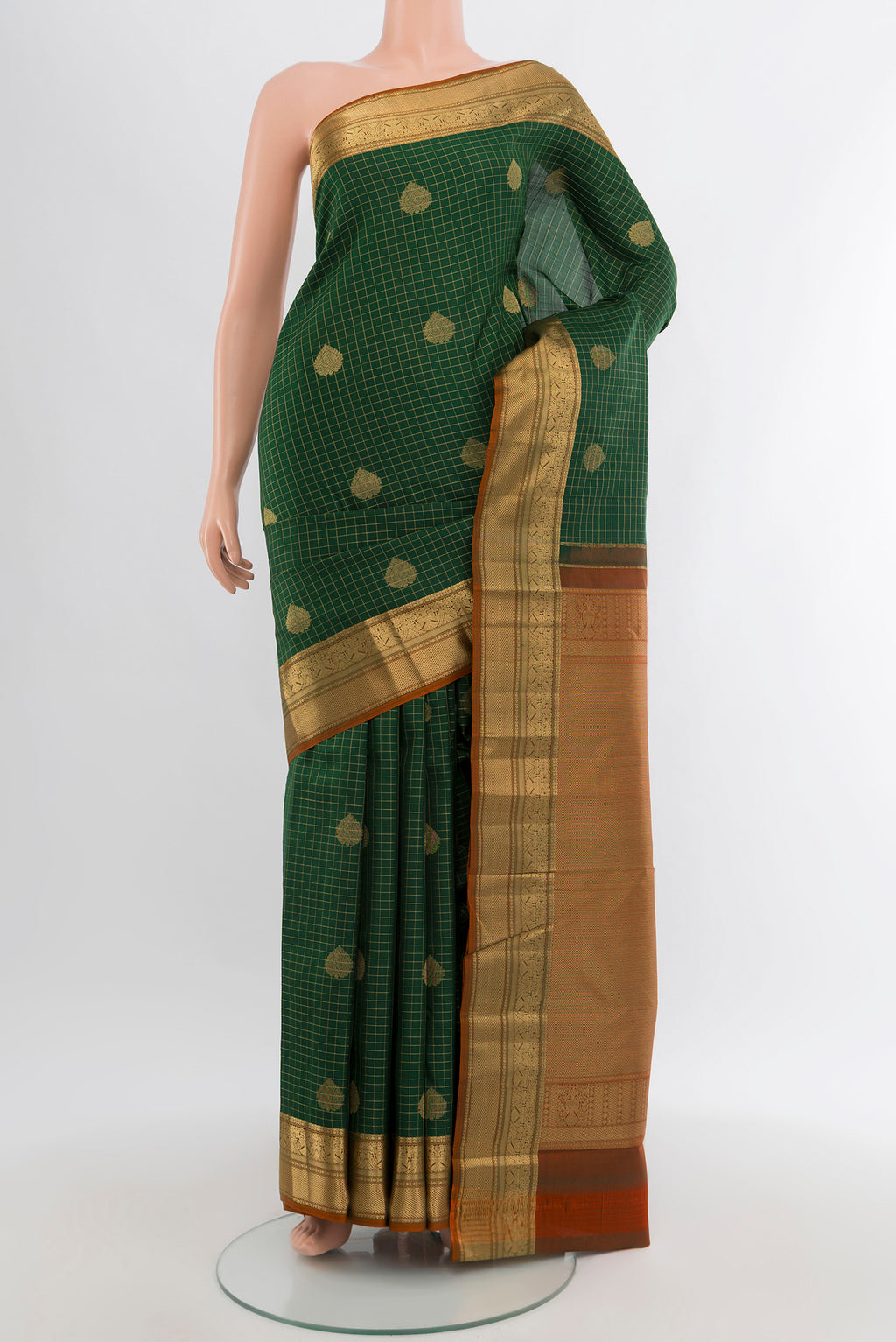 Bottle Green Kanjivaram Silk Saree with Checked design on the body and Zari Border.  displayed on a mannequin