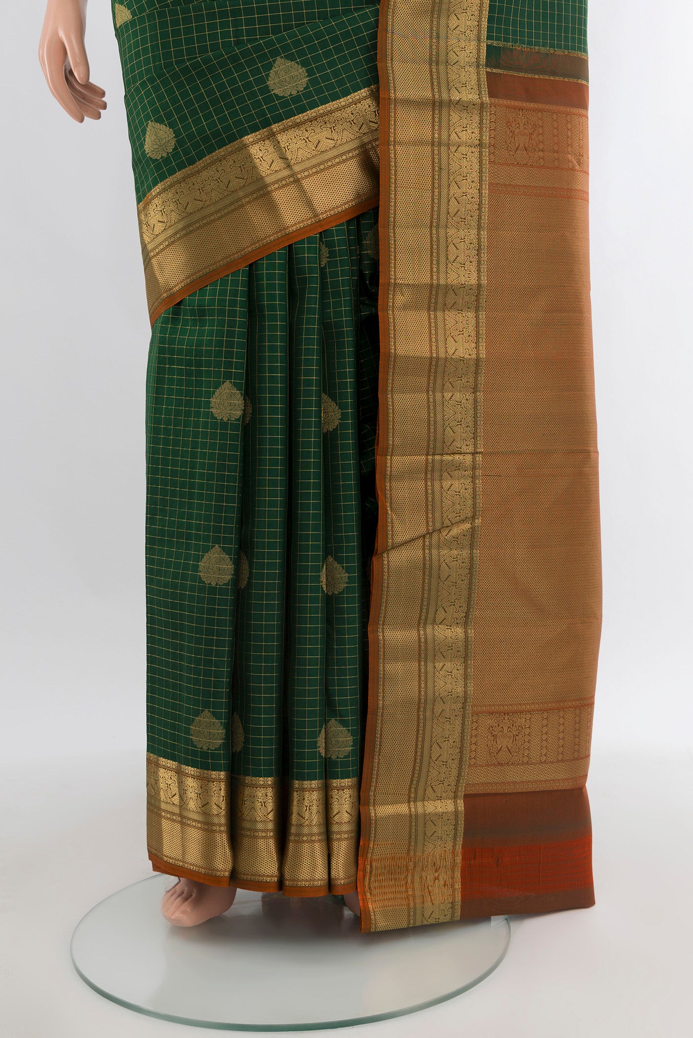 Pleats and pallu of Bottle Green Kanjivaram Silk Saree with Checked design on the body and Zari Border. 