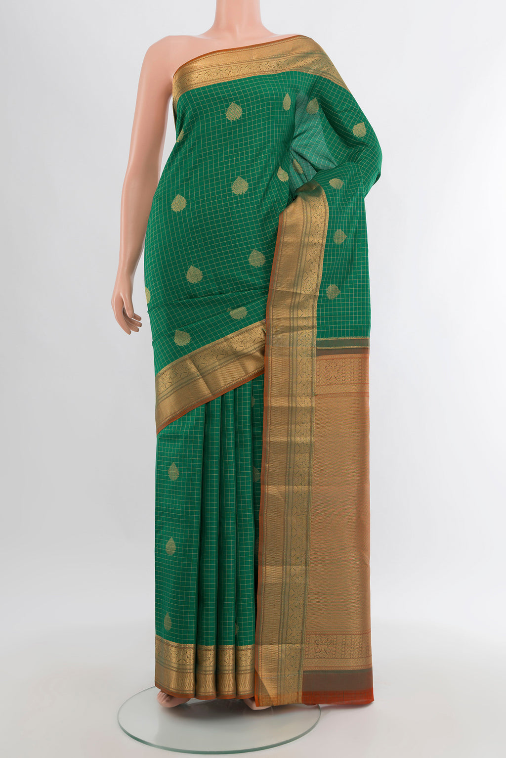 Green Kanjivaram Silk Saree with Checked design on the body and Zari Border.  displayed on a mannequin