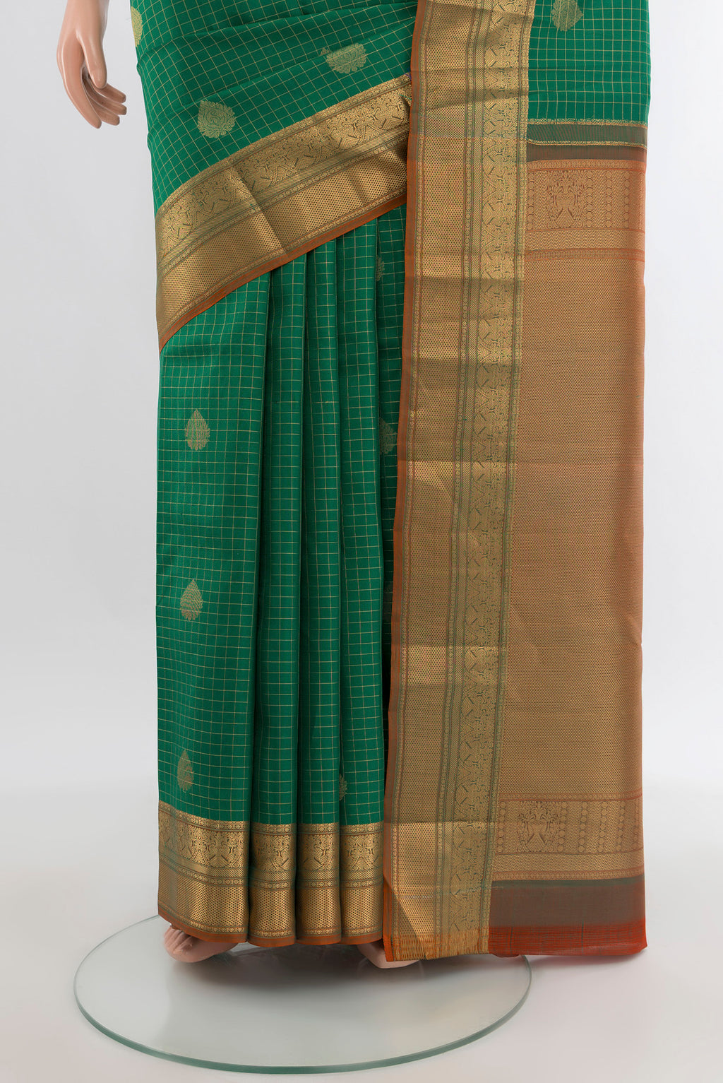 Pleats and pallu of Green Kanjivaram Silk Saree with Checked design on the body and Zari Border. 