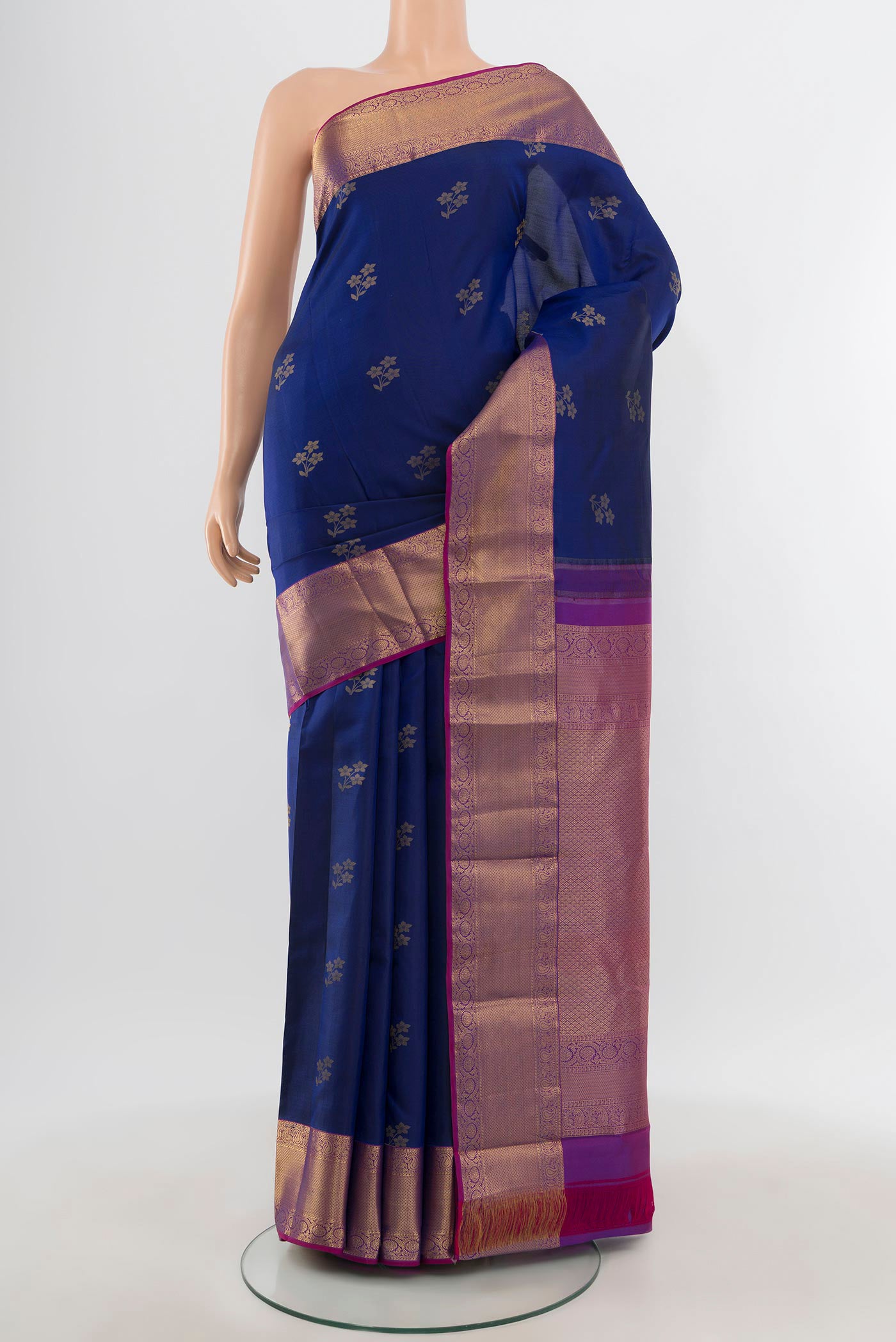 Dark Blue Kanjivaram Silk Saree with Zari Butta on the body and Zari Border.  displayed on a mannequin