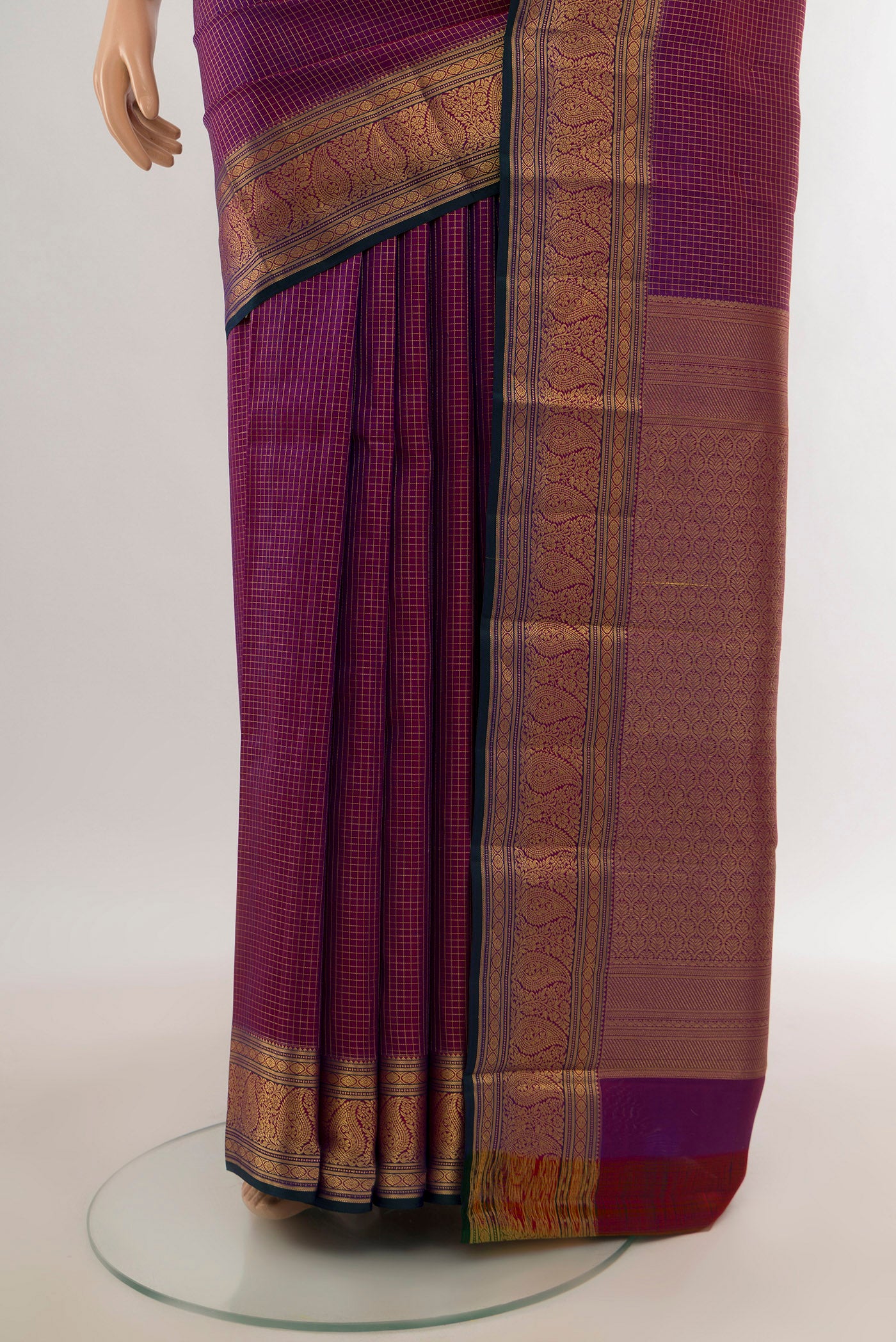 Pleats and pallu of Purple Kanchipuram Silk Saree with Checked design on the body and Zari Border. 