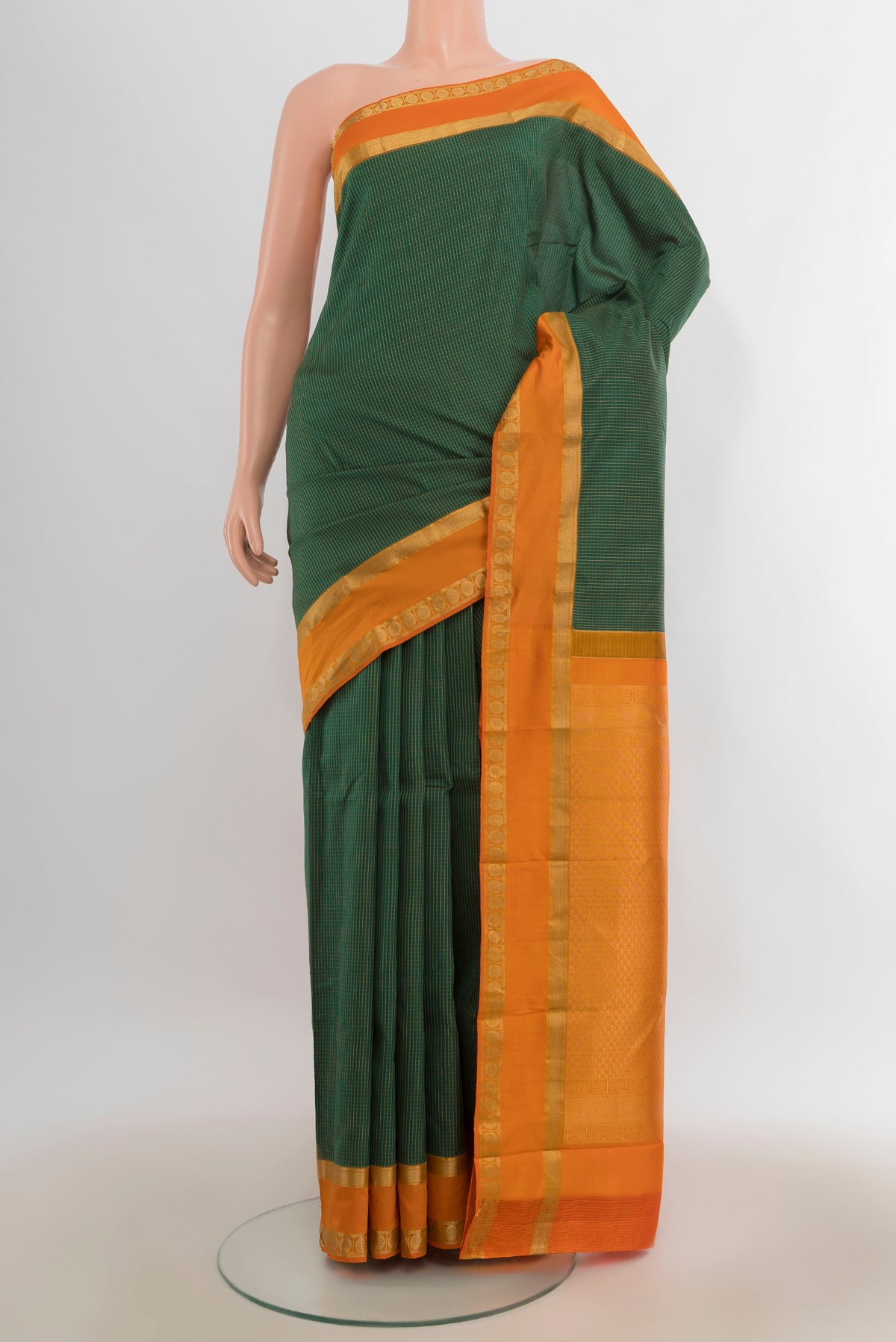 Pure Silk Green Kanjivaram Saree with Checked design on the body and Zari Border.  displayed on a mannequin