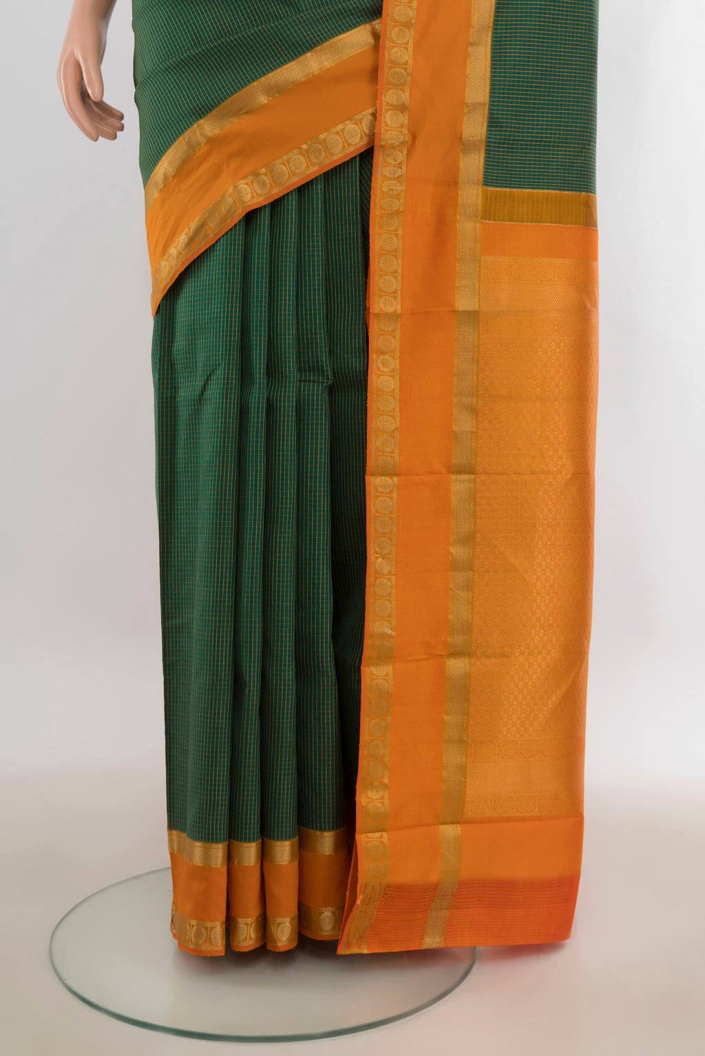 Pleats and pallu of Pure Silk Green Kanjivaram Saree with Checked design on the body and Zari Border. 