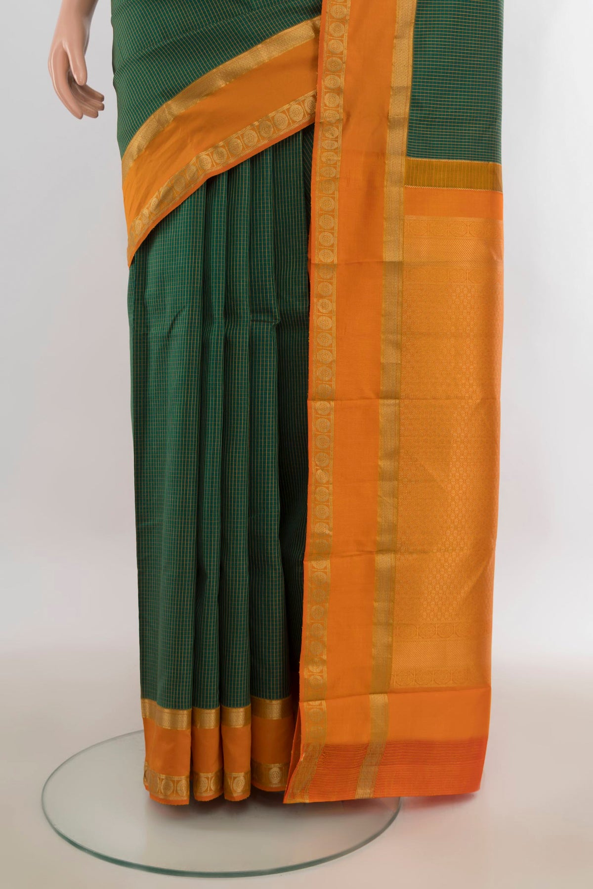 Pleats and pallu of Pure Silk Green Kanjivaram Saree with Checked design on the body and Zari Border. 