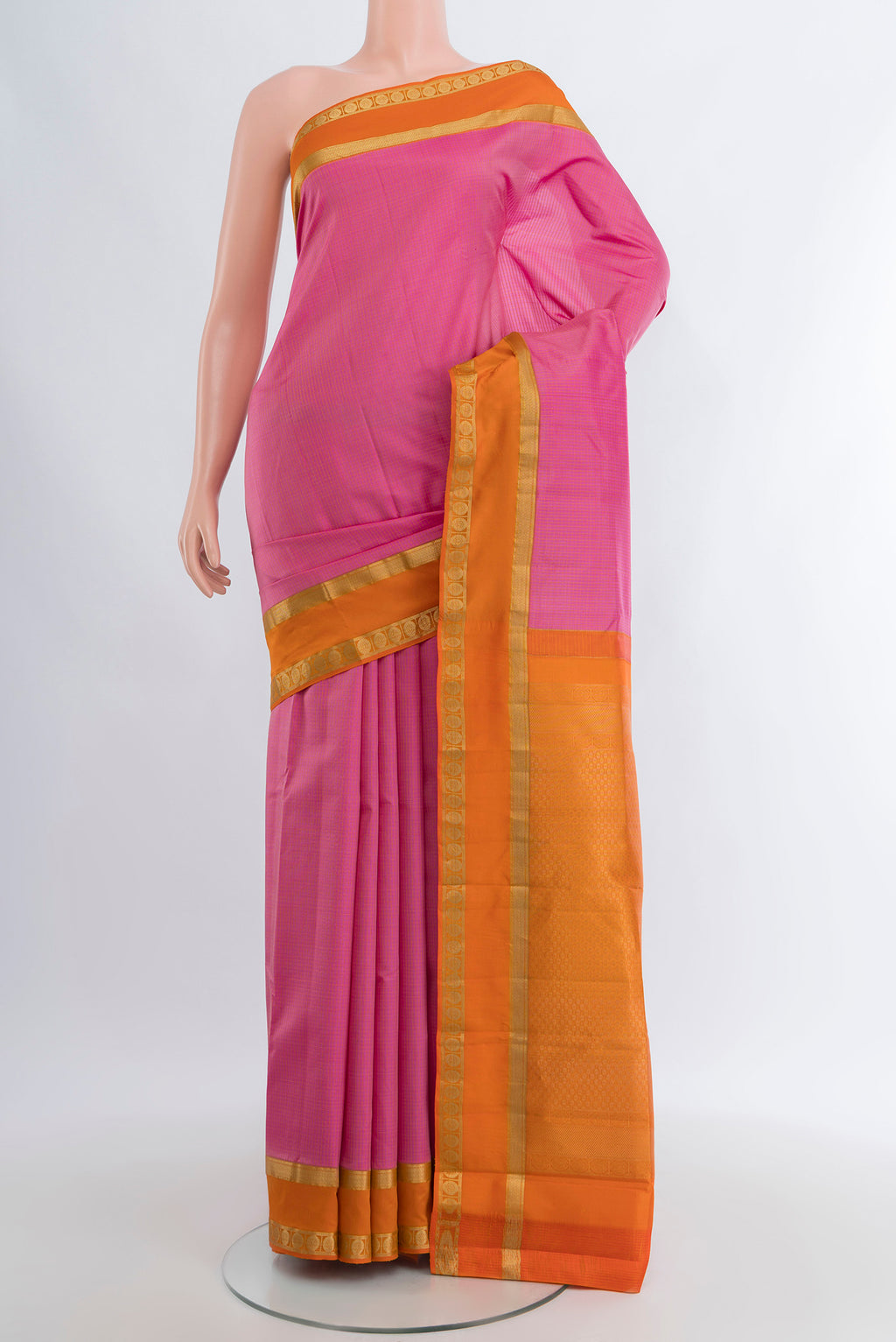 Rose pink Kanjivaram Silk Saree with Checked design on the body and Zari Border.  displayed on a mannequin