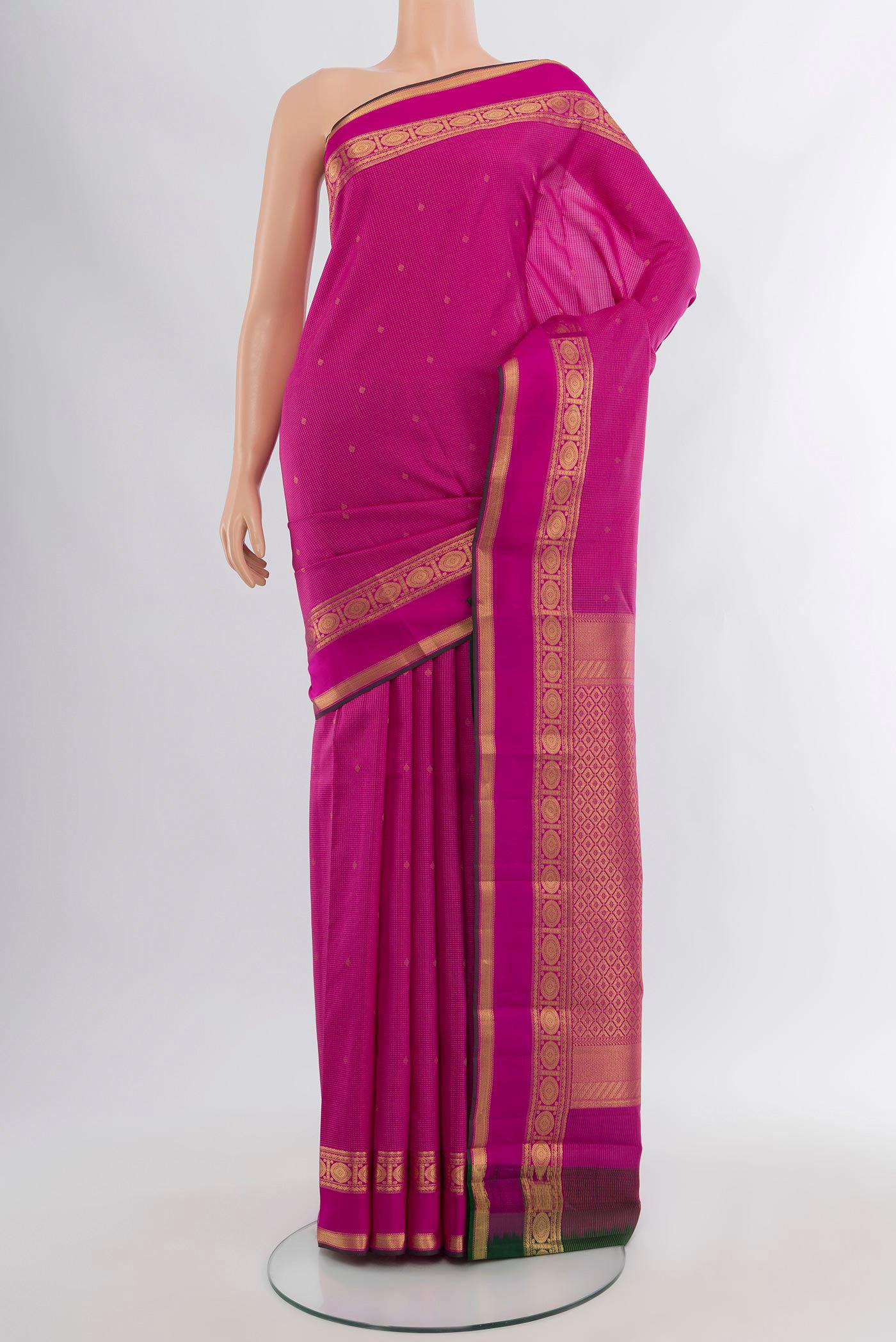 Magenta Kanjivaram Silk Saree with Zari Butta on the body and Zari Border.  displayed on a mannequin