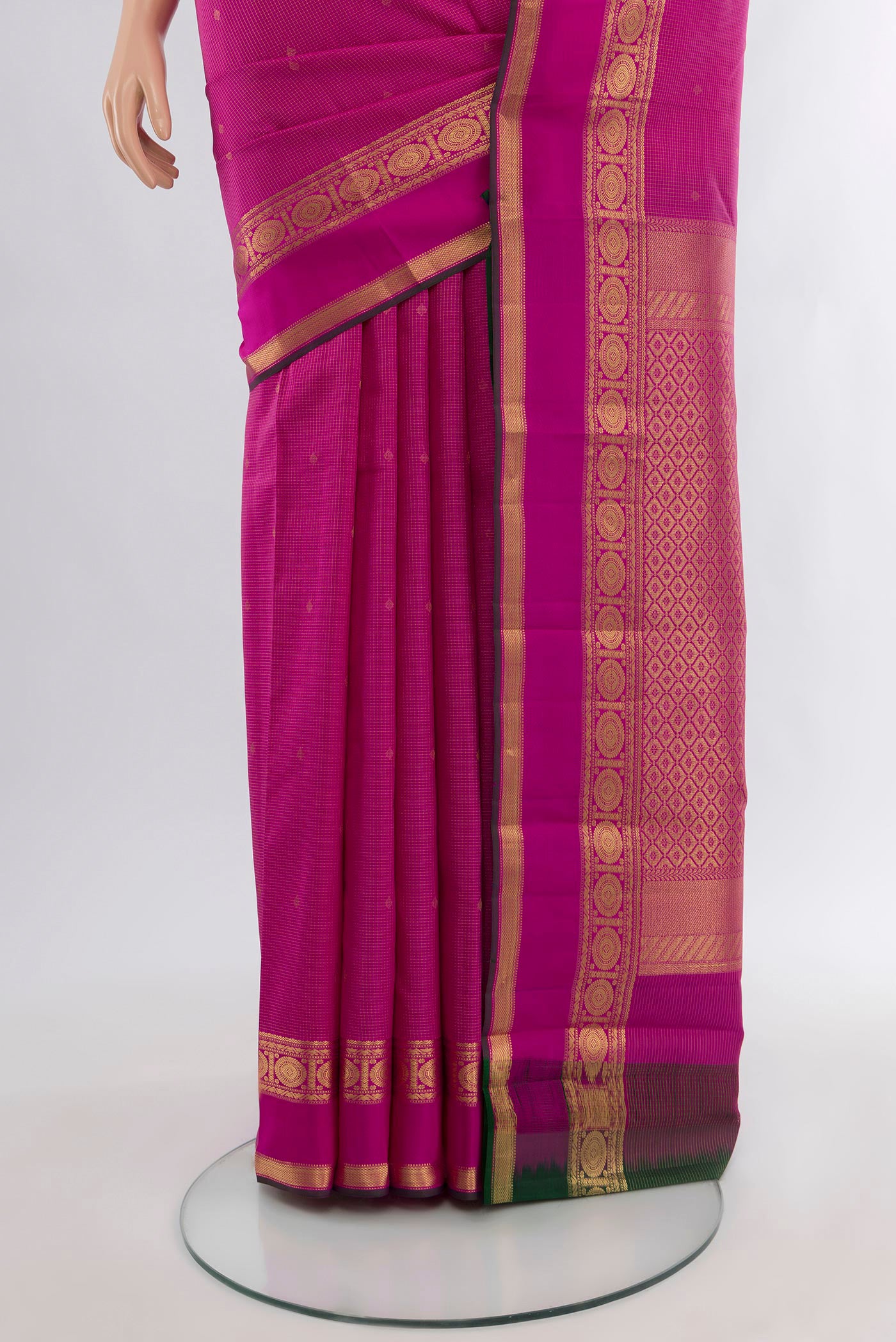 Pleats and pallu of Magenta Kanjivaram Silk Saree with Zari Butta on the body and Zari Border. 