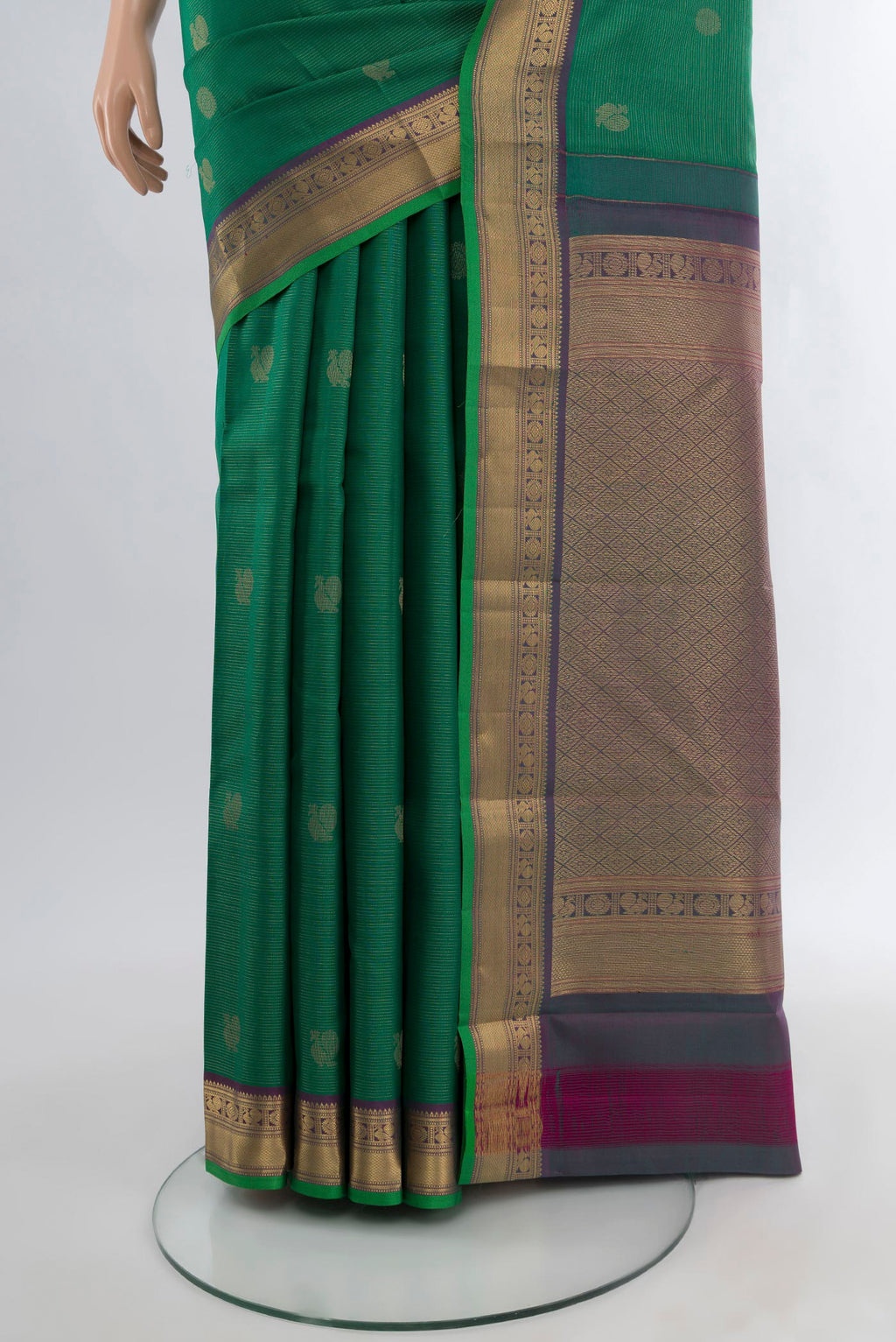 Pleats and pallu of Green Kanchipuram Silk Saree with Zari Butta on the body and Zari Border. 