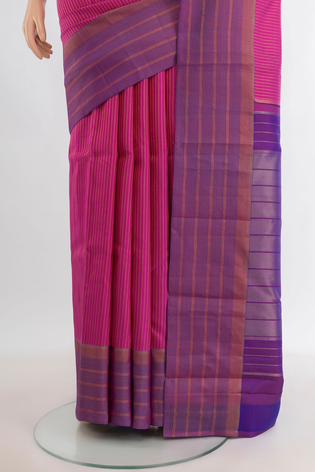 Pleats and pallu of Magenta Kanchipuram Silk Saree with Stripes on the body and Zari Border. 