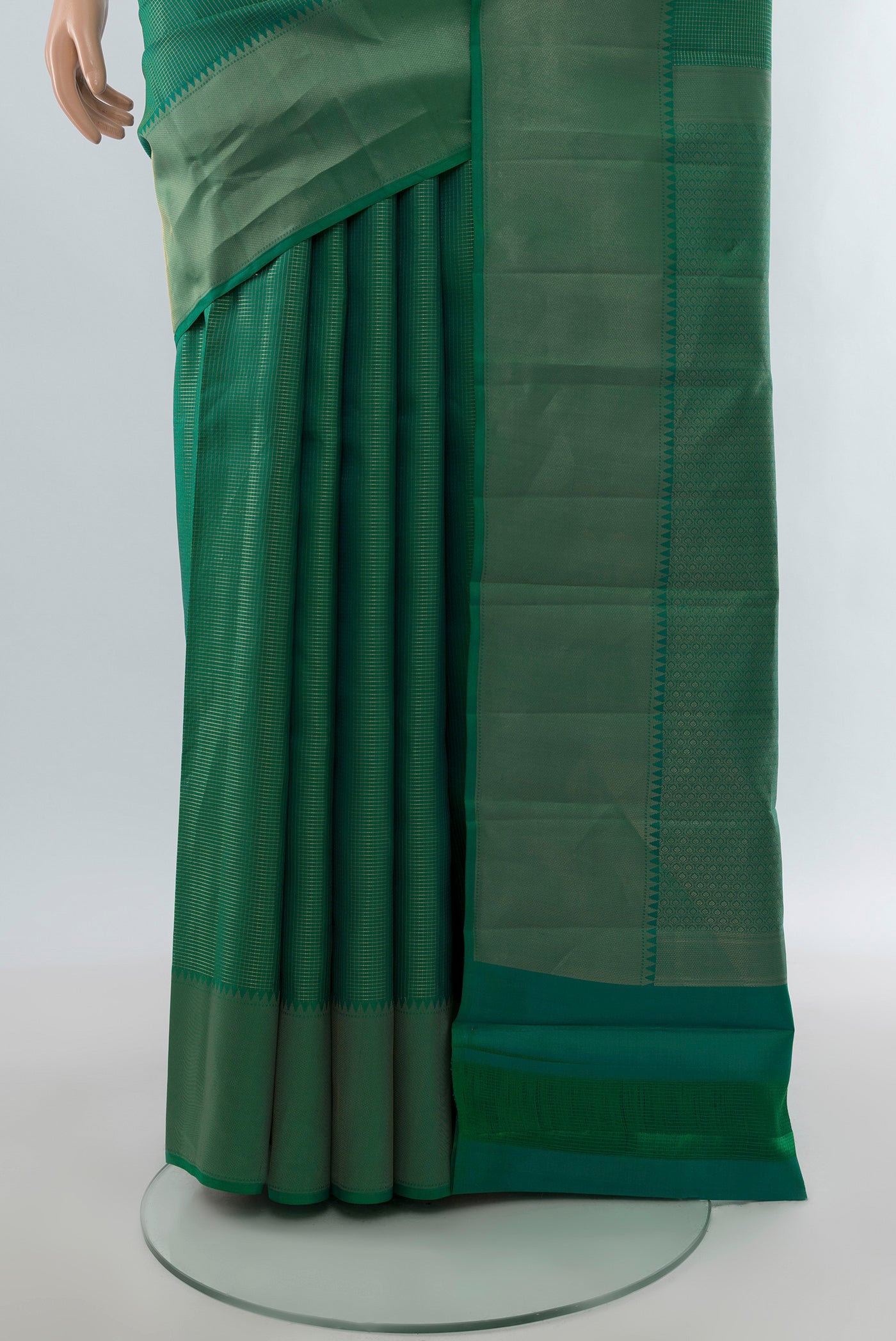 Pleats and pallu of Green Kanchipuram Silk Saree with Checked design on the body and Zari Border. 