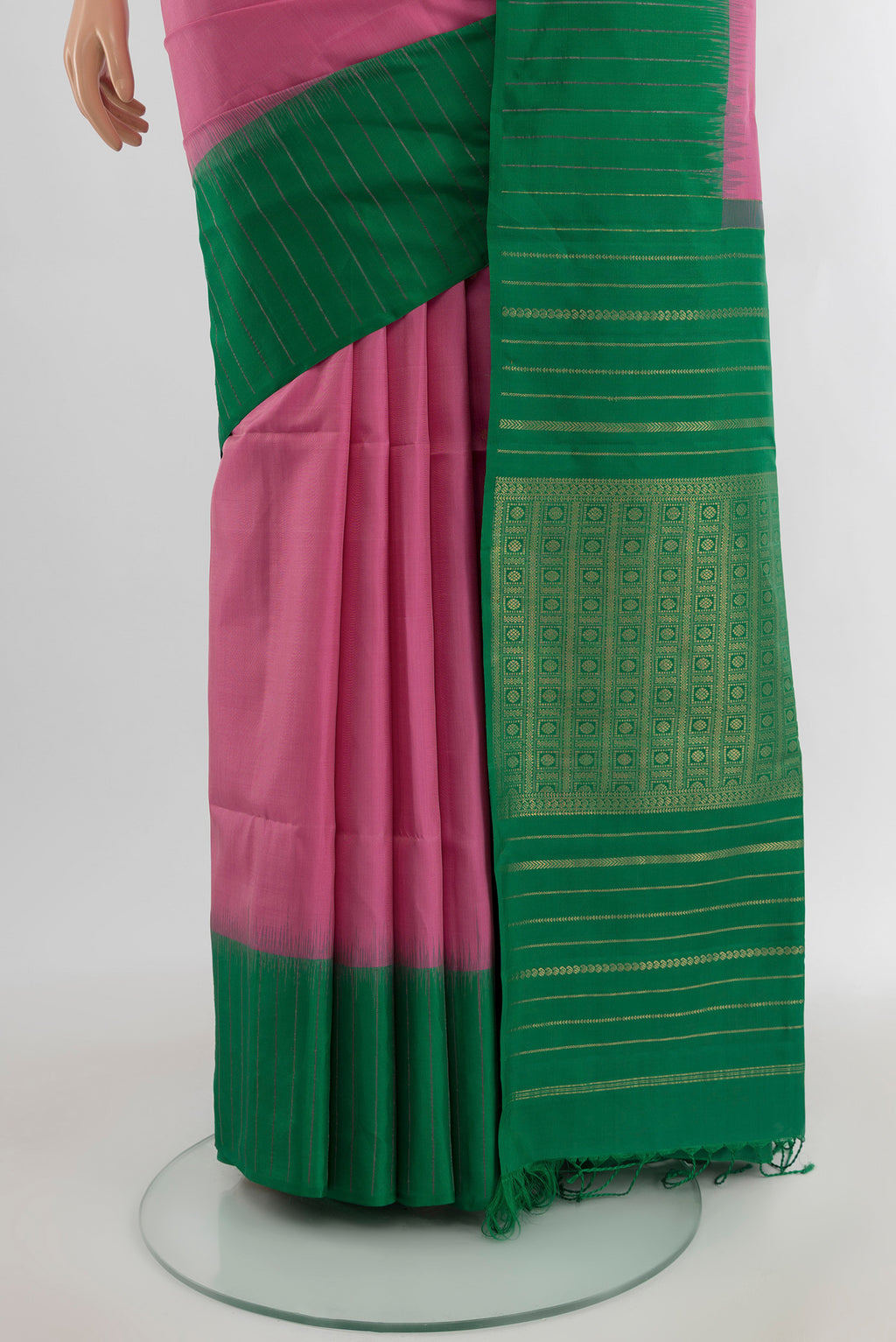 Pleats and pallu of Rose pink Soft Silk Saree with Zari Butta on the body and Plain Border. 