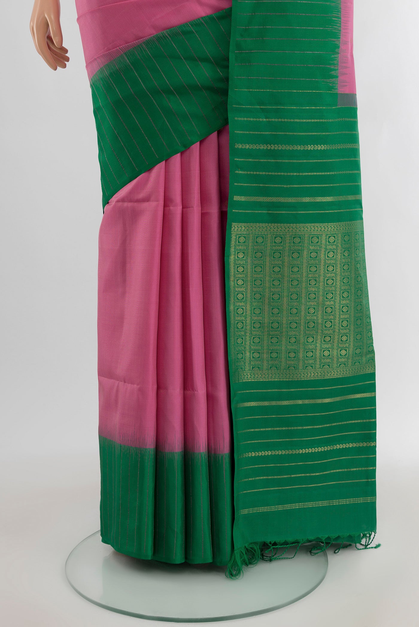 Pleats and pallu of Rose pink Soft Silk Saree with Zari Butta on the body and Plain Border. 