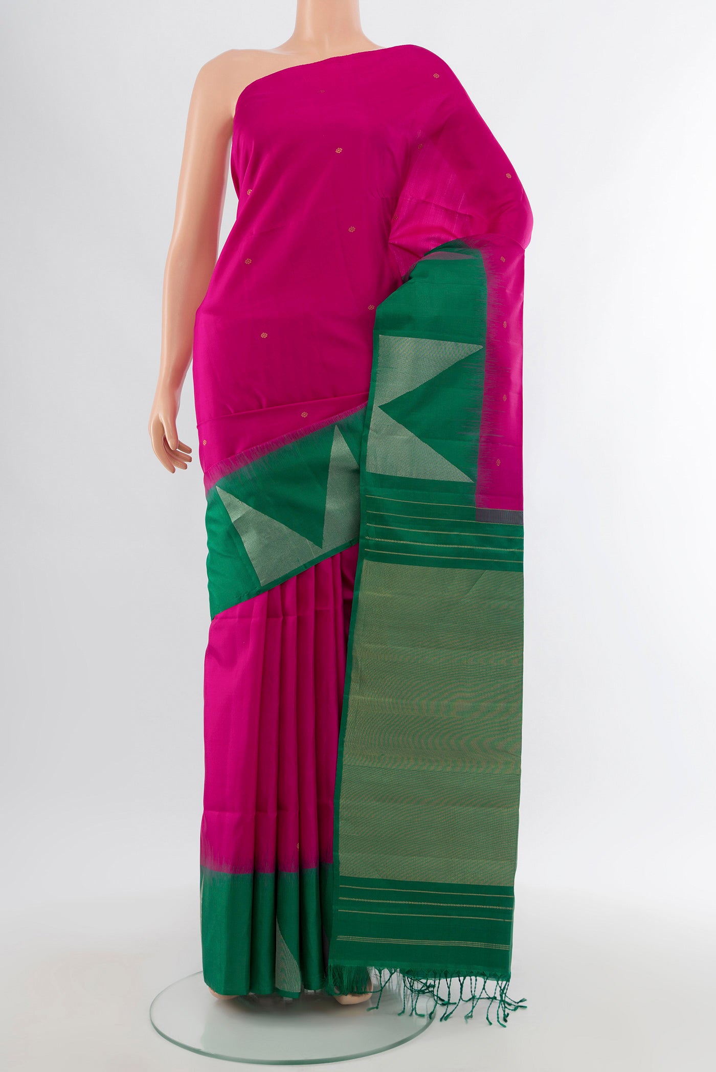 Rani Pink Soft Silk Saree with Zari Butta on the body and Fancy Border.  displayed on a mannequin