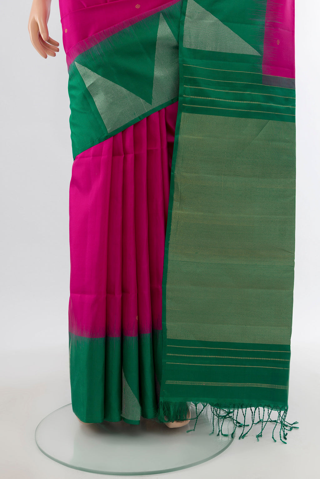 Pleats and pallu of Rani Pink Soft Silk Saree with Zari Butta on the body and Fancy Border. 