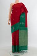 Red Soft Silk Saree with Zari Butta on the body and Fancy Border.  displayed on a mannequin
