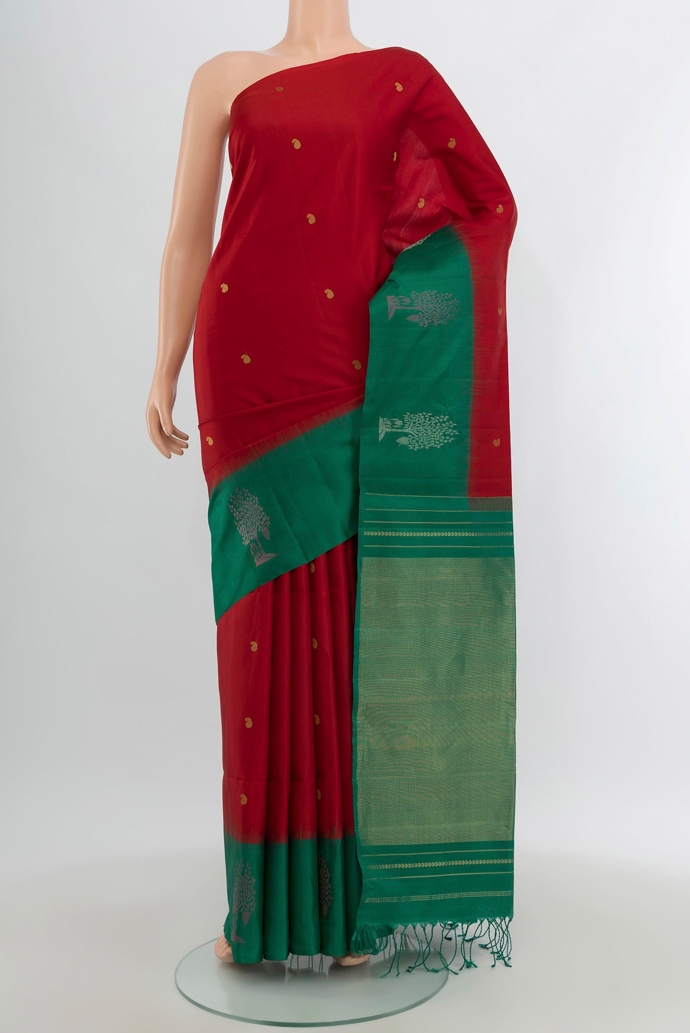 Red Soft Silk Saree with Zari Butta on the body and Fancy Border.  displayed on a mannequin