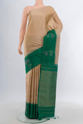 Dark Beige Soft Silk Saree with Zari Butta on the body and Fancy Border.  displayed on a mannequin