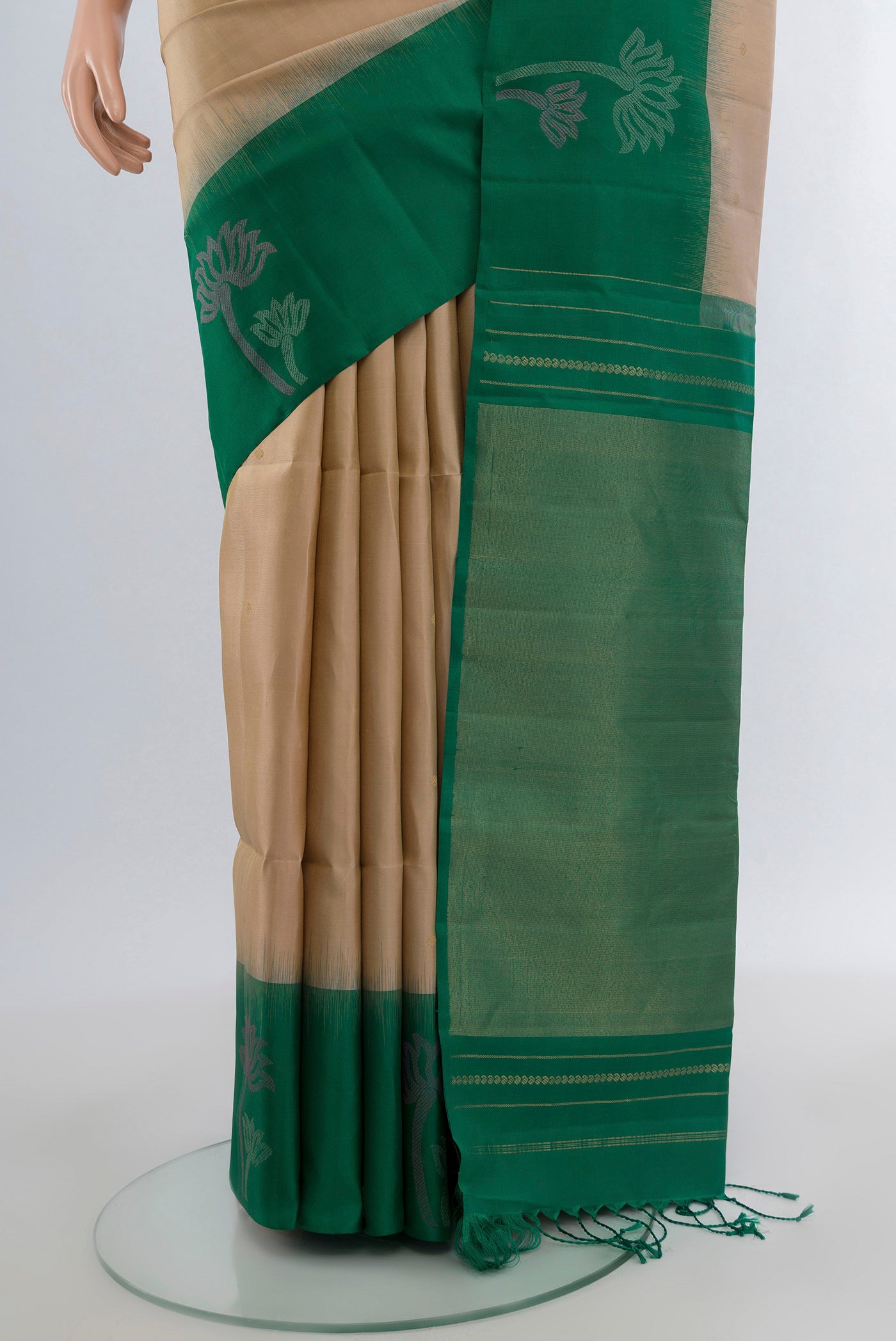Pleats and pallu of Dark Beige Soft Silk Saree with Zari Butta on the body and Fancy Border. 