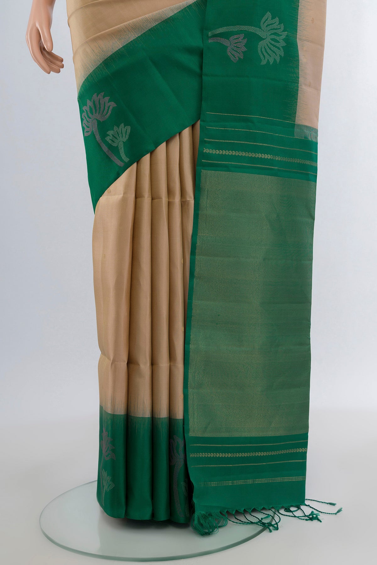 Pleats and pallu of Dark Beige Soft Silk Saree with Zari Butta on the body and Fancy Border. 