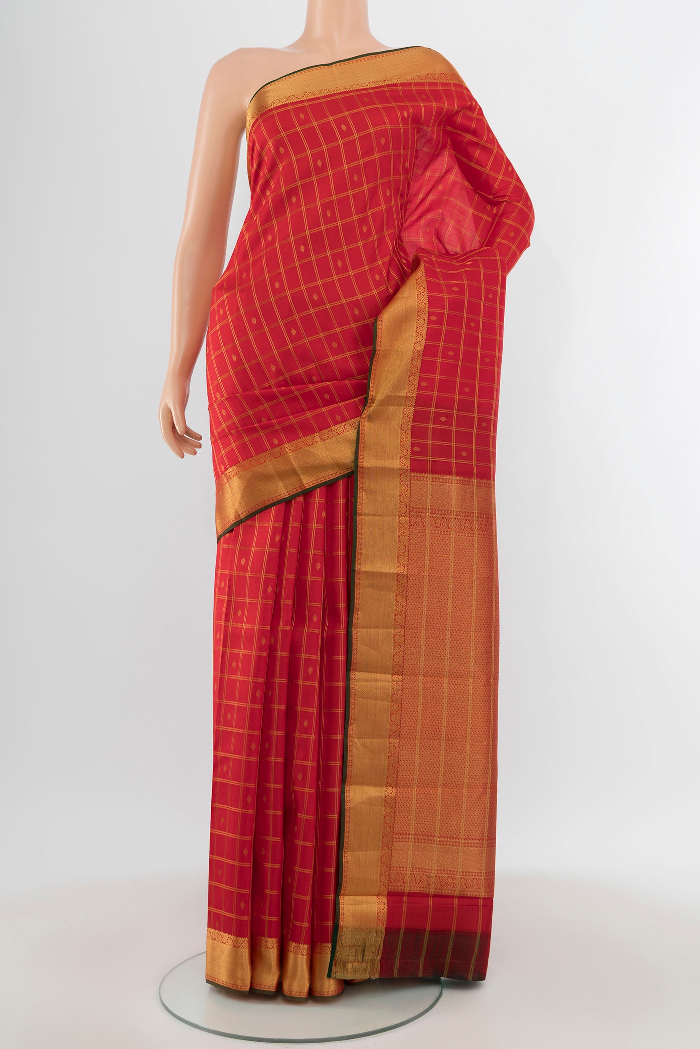 Coral Kanchipuram Silk Saree with Checked design on the body and Zari Border.  displayed on a mannequin