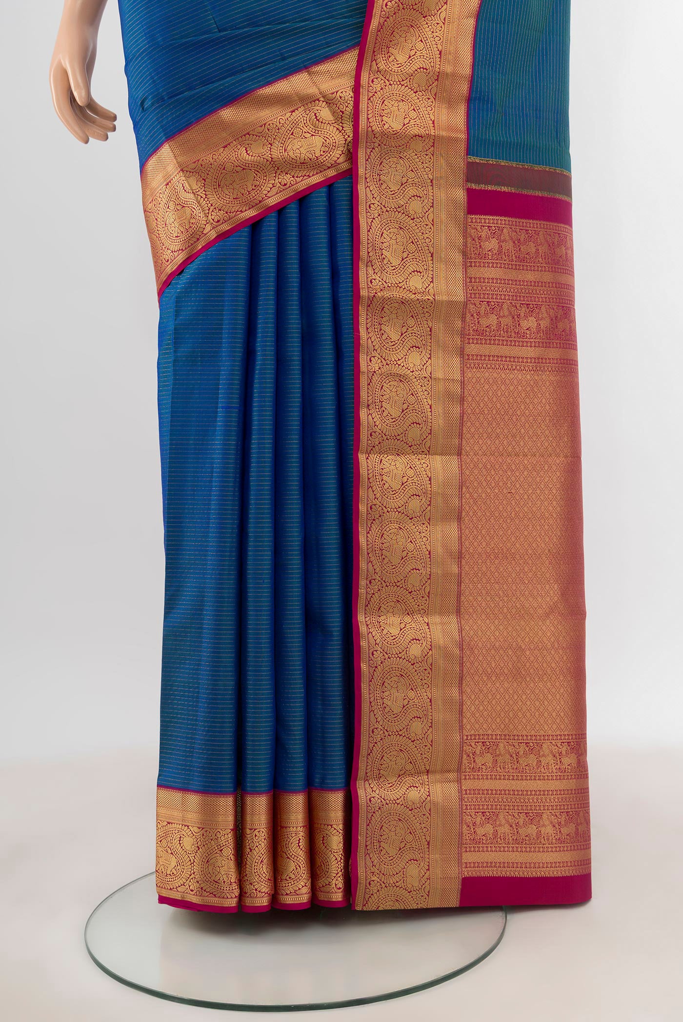 Pleats and pallu of Blue Kanchipuram Silk Saree with Zari Butta on the body and Zari Border. 