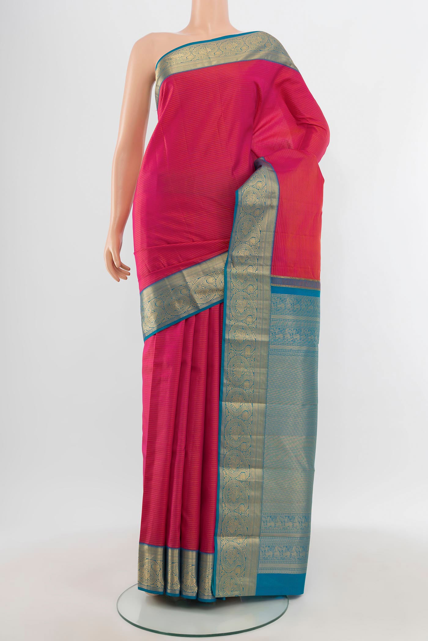 Pink Kanchipuram Silk Saree with Stripes on the body and Zari Border.  displayed on a mannequin