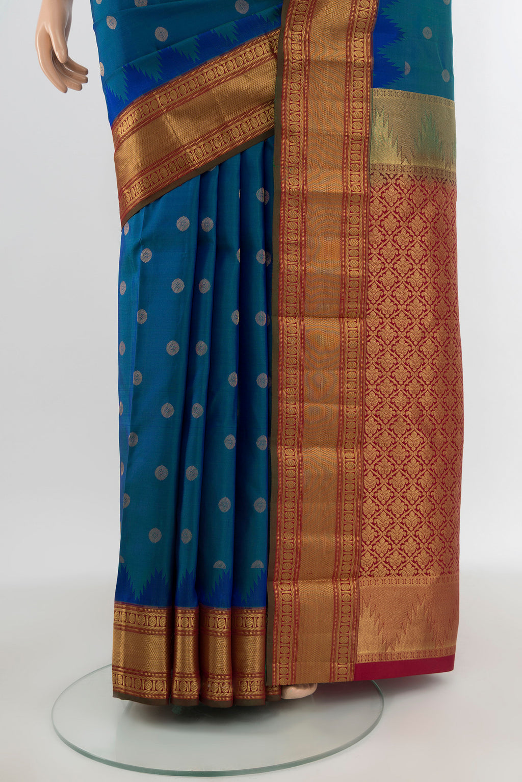 Pleats and pallu of Peacock Blue Kanchipuram Silk Saree with Zari Butta on the body and Zari Border. 