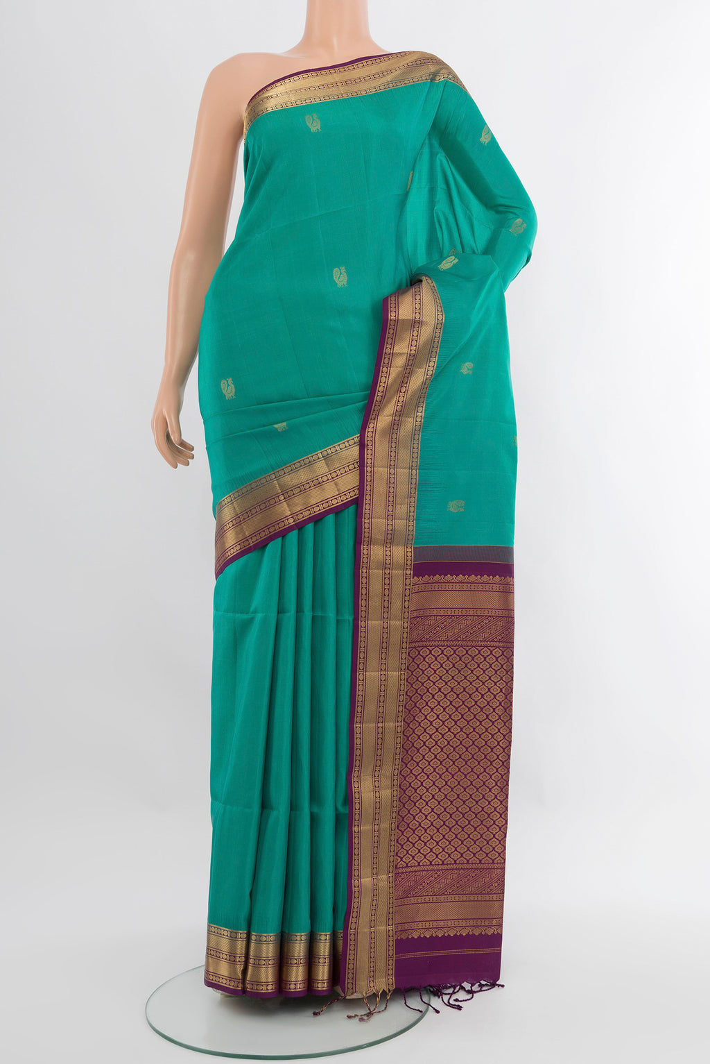Sea Green Soft Silk Saree with Zari Butta on the body and Zari Border.  displayed on a mannequin