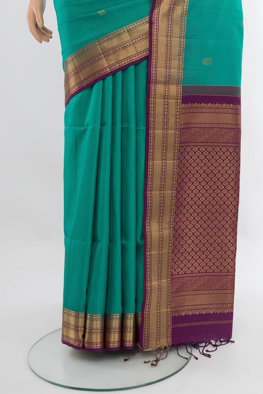 Pleats and pallu of Sea Green Soft Silk Saree with Zari Butta on the body and Zari Border. 