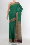 Green Kanchipuram Silk Saree with Checked design on the body and Zari Border.  displayed on a mannequin