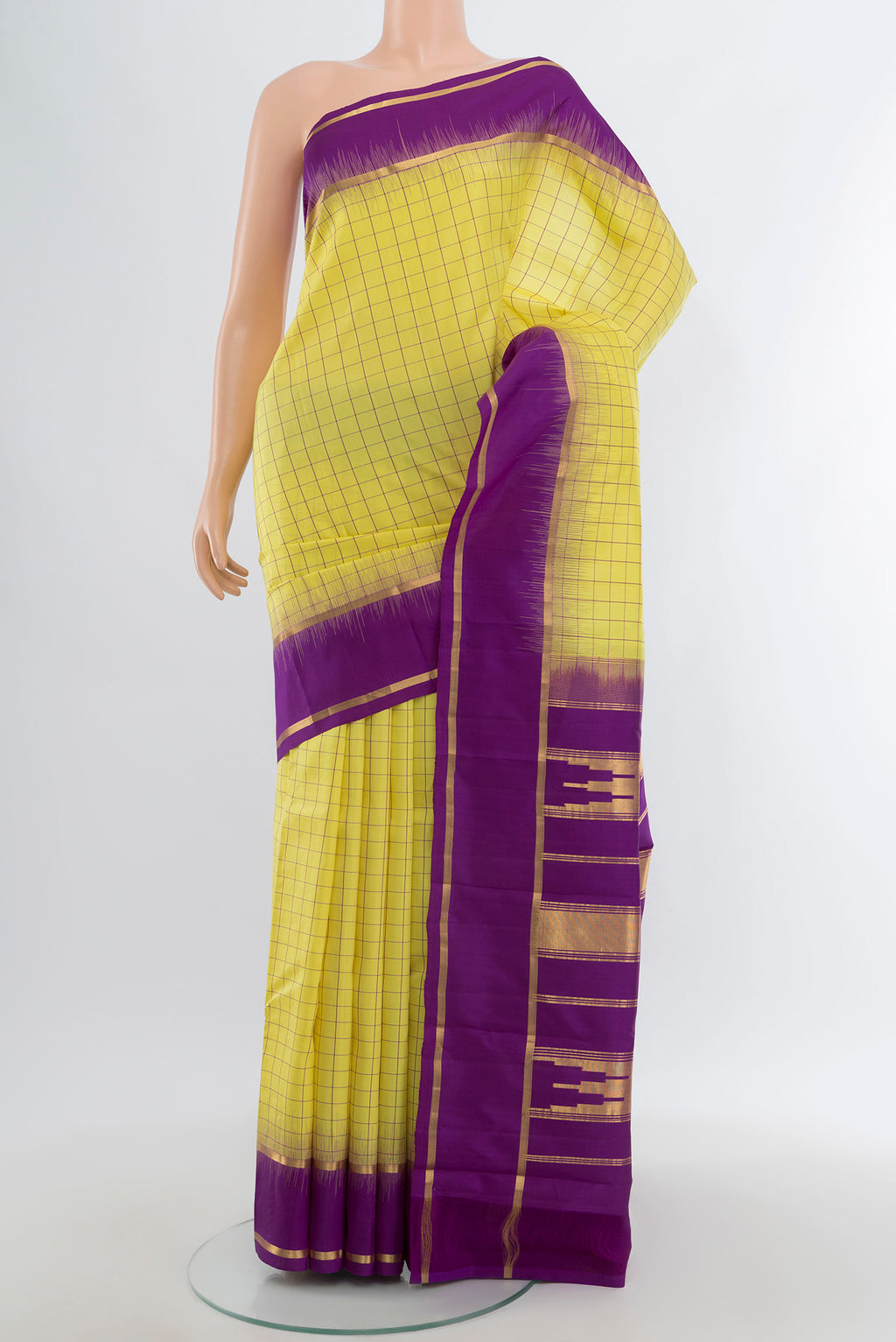 Lemon Yellow Kanchipuram Silk Saree with Checked design on the body and Plain Border.  displayed on a mannequin