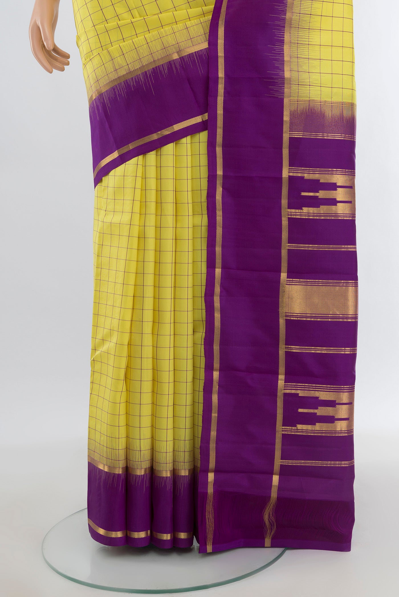 Pleats and pallu of Lemon Yellow Kanchipuram Silk Saree with Checked design on the body and Plain Border. 