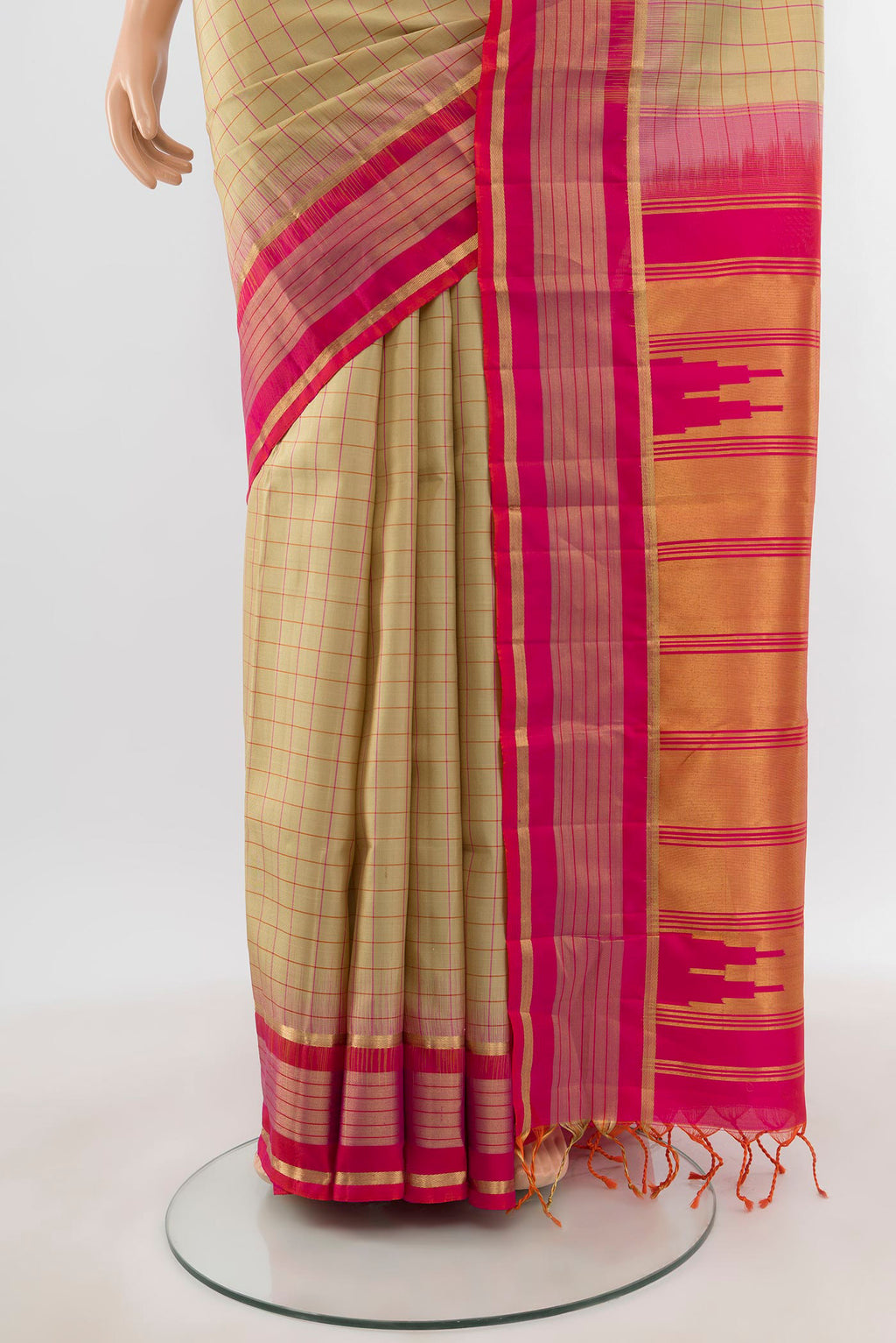 Pleats and pallu of Beige Soft Silk Saree with Checked design on the body and Zari Border. 