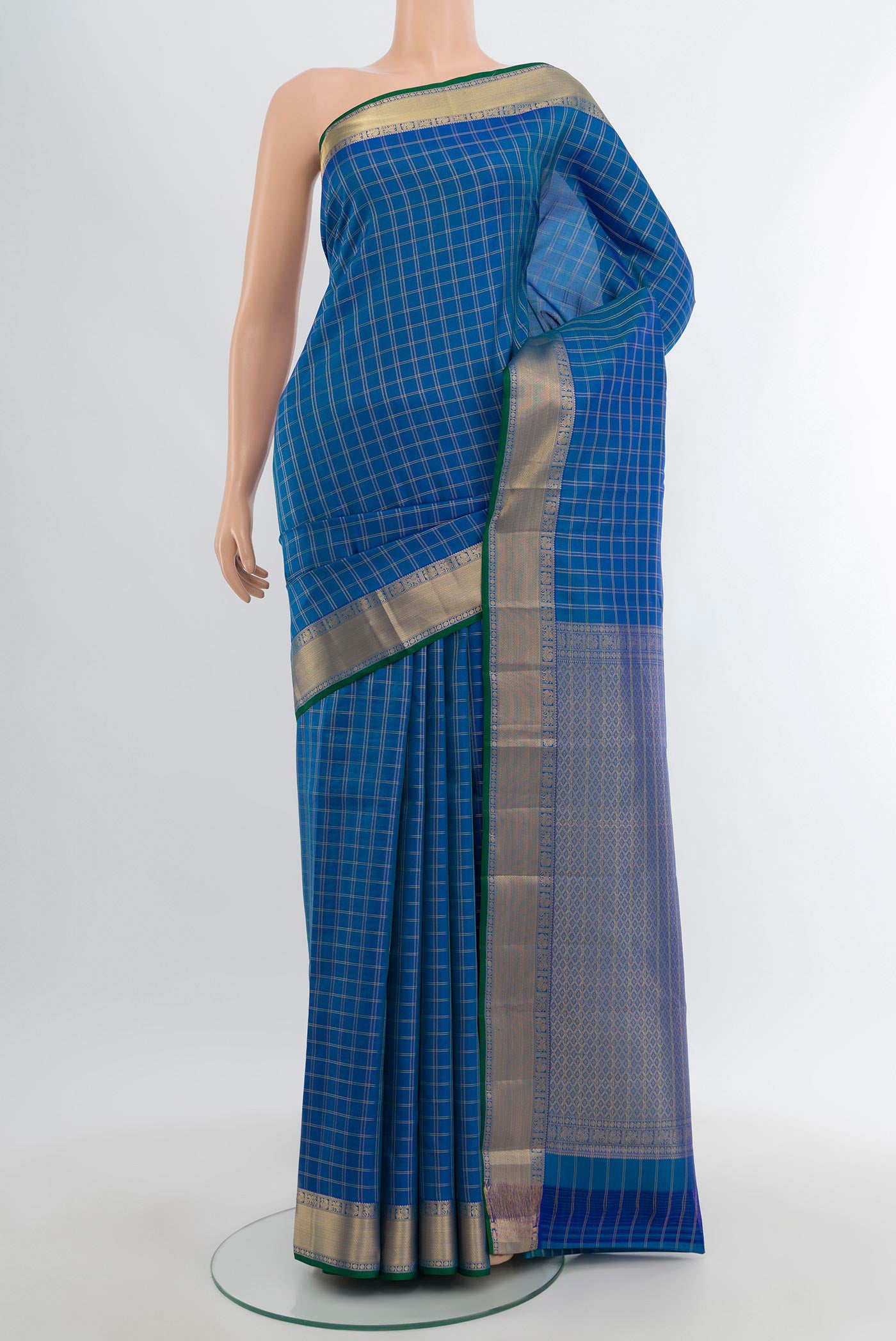 Blue Kanchipuram Silk Saree with Checked design on the body and Zari Border.  displayed on a mannequin