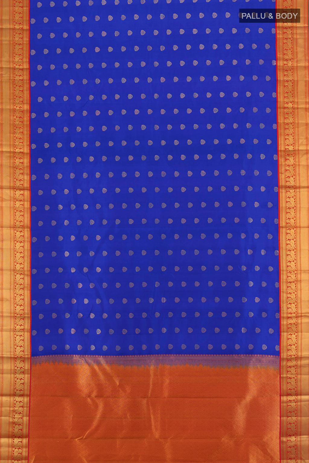 Flat view of Royal Blue Kanchipuram Silk Saree with Zari Butta on the body and Zari Border. 