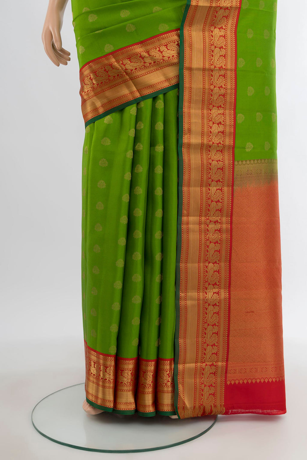 Pleats and pallu of Green Kanchipuram Silk Saree with Zari Butta on the body and Zari Border. 