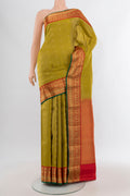 Green Kanchipuram Silk Saree with Zari Butta on the body and Zari Border.  displayed on a mannequin