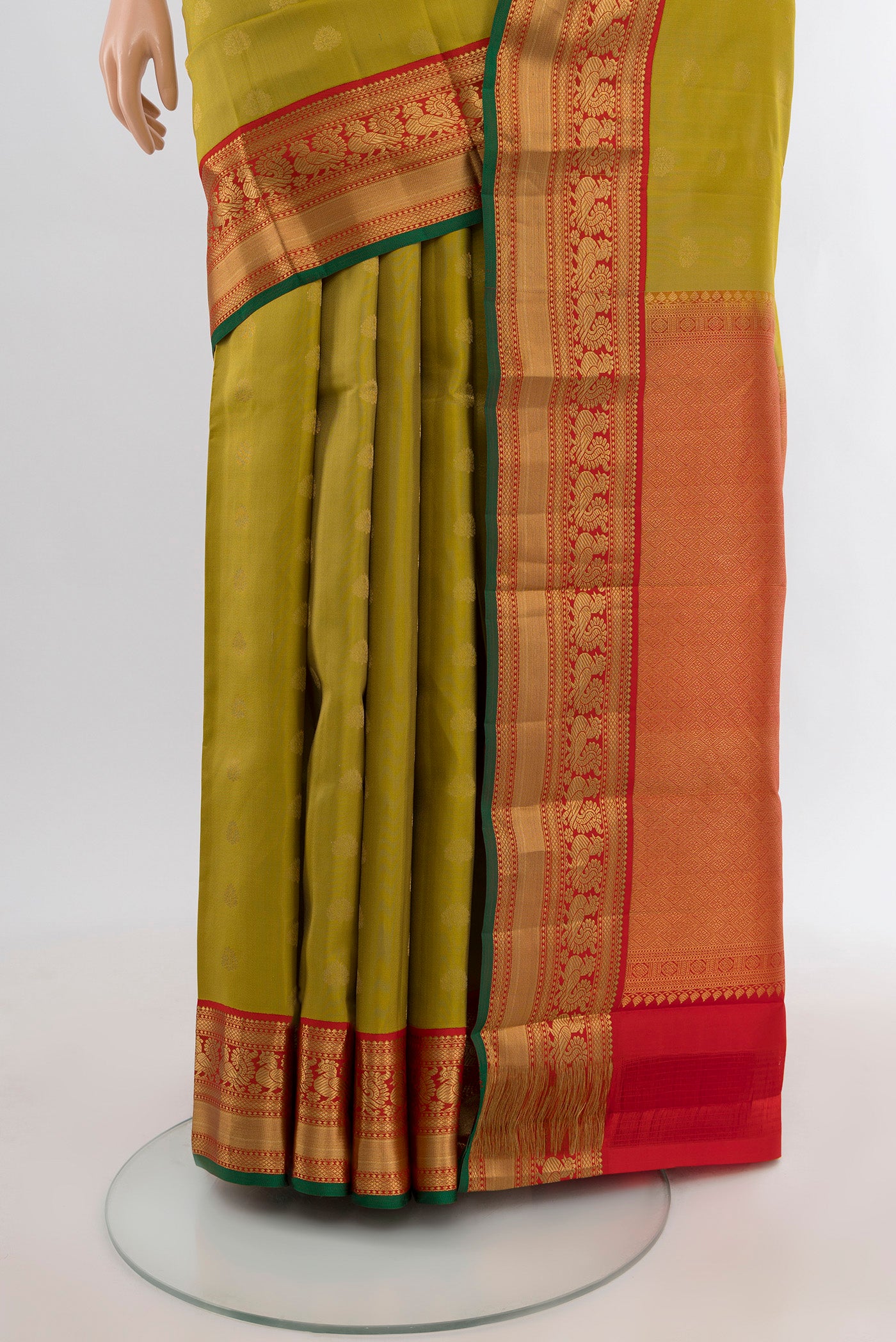 Pleats and pallu of Green Kanchipuram Silk Saree with Zari Butta on the body and Zari Border. 